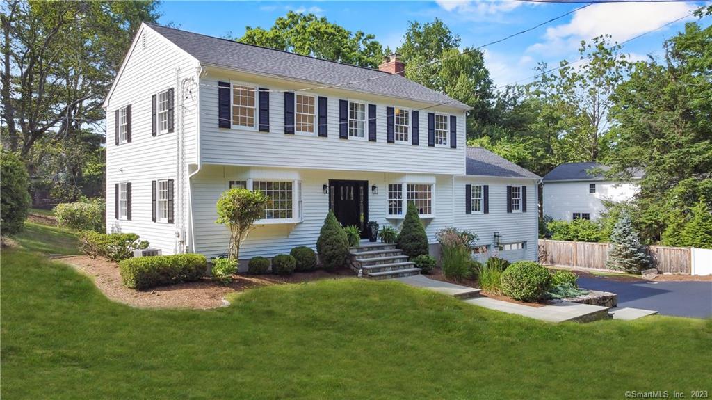 Walk to town & arrive at the train to NYC in only 5 minutes, from this updated 5 bedroom, 3.5 bath colonial w/ a finished lower level, a mudroom, and a low maintenance deck. Prominently sited on a lovely half-acre parcel, 17 Whitney Street is in a quiet neighborhood within walking distance to nearby amenities such as Trader Joe's, Winslow Dog Park, Levitt Pavilion, Country Playhouse, Westport Library, top-rated restaurants & the vibrant Westport downtown area. As you enter this classic colonial, you will immediately notice the abundance of natural light that fills every room. The newly refinished hardwood floors add elegance & the carefully curated light fixtures accentuate the beauty of every space. Upstairs there are 4 bedrooms and 2 full bathrooms with 1st and 2nd-floor primary bedroom suite options. The primary bedroom suite features a spa tub, luxe shower, double sinks, heated flooring, and Carrera marble countertop, floor & shower surround. The stunning great room features wood beams & a floor-to-ceiling wood-burning fireplace. The oversized deck leads to a private yard with mature trees, a large children's playground area & a future pool site. The sewer assessment has been paid, offering the new owners the ability to convert to town sewer if desired (under 10k est.). Located only 2.8 miles from the Westport Train Station and close to Compo Beach, this home is also close to top-rated schools. Staples is ranked the #1 public high school in CT. Seller can close quickly.