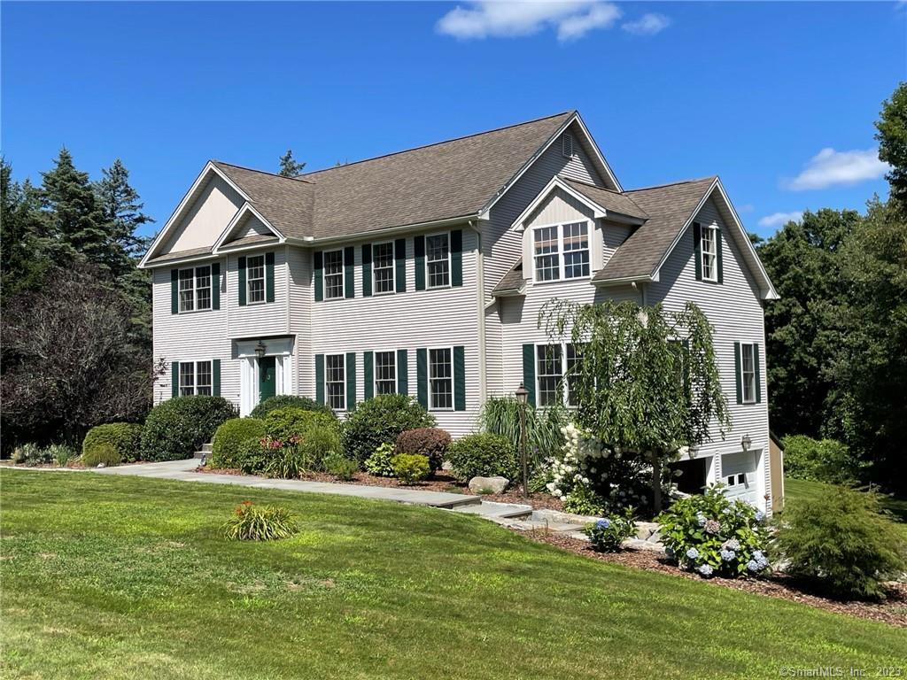 Stunning 4 bedroom Colonial situated on just over an acre in Woodbury, CT. Light and bright kitchen with gleaming hardwood floors and eat-in dining area overlooks a private backyard. Stainless steel appliances and large kitchen island ideal for food prep. Spacious living room includes new carpeting, fireplace and large windows which allow for much natural light. Formal dining room rests directly off the kitchen perfect for entertaining. French doors lead to an office area with hardwood floors and fireplace. Generously sized primary bedroom suite offers a full bath, dressing area, and walk-in closet. Three additional bedrooms with wall to wall carpeting and a full bathroom complete the upper level. Partially finished basement with walkout to the backyard. Desirable main level laundry room. Paved driveway and 2-car under house garage. Well maintained and beautifully landscaped. Book your showing today!