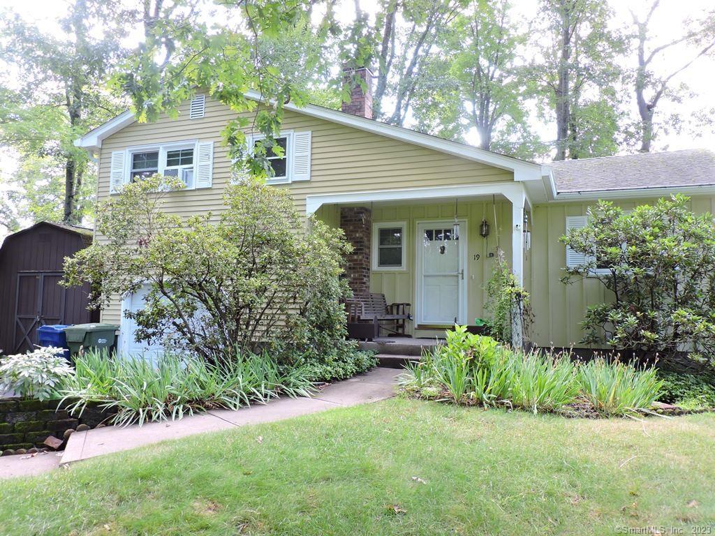Great opportunity to own this spacious split level home offering three bedrooms, one and a half baths and 1 car attached garage. Covered front porch and a large outbuilding. Roof and windows are approximately 5 years old. Kitchen has updated flooring and refrigerator. Large living room with vaulted ceiling opens to dining room. Hardwood floors on first level and upstairs. Full bath with wainscoting and tile floor. Lower level family room with laminate floors, ceiling fan and slider to level backyard. Good size basement with work bench. Property being sold in AS-IS condition.