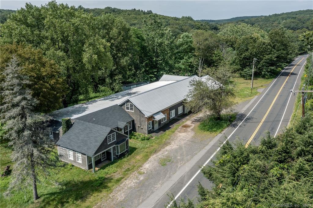 Sprawling Commercial Building Offers a Multitude of Options. Fabulous Potential! Over 9-Acres of Land. Well Located Between Washington & Woodbury CT.