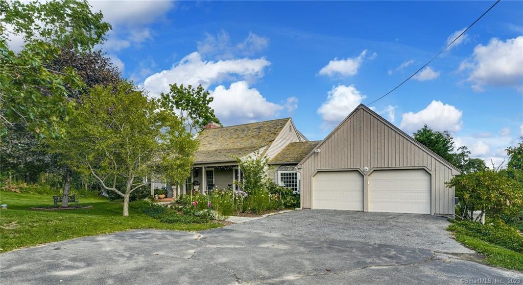 Welcome to this charming reproduction Cape Cod home in park-like setting! This timeless beauty is filled with character and boasts a wood roof and expansive front porch, providing a warm and inviting exterior. Step inside and be captivated by the elegant brick accents and wide board pegged hardwood floors, exuding a classic yet sophisticated atmosphere. With not one, not two, but three fireplaces, you'll enjoy cozy evenings and a touch of romance throughout the house. The first floor features a delightful surprise.. a primary bedroom suite offering convenience and flexibility for your lifestyle. In addition to its charm, this home has been thoughtfully updated, ensuring modern comforts without compromising its traditional allure. The layout even allows for a potential in-law setup if needed, making it ideal for multi-generational living or welcoming guests. Don't miss your chance to own this enchanting Cape Cod reproduction, a home that harmoniously blends old-world charm with contemporary living. New whole house generator for added peace of mind. Schedule a showing today and experience its captivating beauty for yourself!