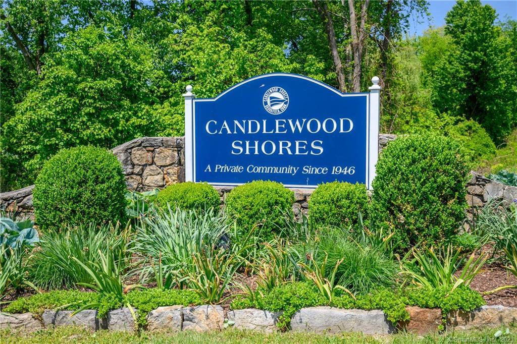 This fabulous, 3948 sf, move-in-ready direct waterfront home is perfect for year-round living or weekend/summer escapes ~ Welcome to Candlewood Shores at Candlewood Lake. Complete with private sandy beach, dock, boat lift and is being offered fully furnished, with a few exceptions. This home is perfect for entertaining inside and out with an open concept layout and walls of sliders to enter onto the spacious deck overlooking the lake or the main level patio leading to the gorgeous backyard with stonework and unobstructed views of Candlewood Lake. Imagine enjoying your morning coffee on the private deck off the primary bedroom as the sun rises over the lake, it's magical. Located in a 'no wake' zone, this part of the lake is peaceful and you will fall in love with this spectacular setting. The gourmet kitchen with marble and quartz opens to the great room with fireplace, dining area and views galore. Upper level bedrooms with laundry, full hall bath and stunning primary bedroom with private bath. Enjoy lots of fun on the lower walk-out level where you'll find the rec room with spacious custom bar (roughed in for wet bar) & full bath makes it easy to freshen up after a day of boating, water skiing or basking in the sun. Ready to enjoy summer at Candlewood Lake? Enjoy the welcoming contemporary, upscale furnishings for a restful time at the lake. Candlewood Shores amenities include clubhouse, beach, playground, ball field & activities. You'll love it here, only 90 mins to NYC!