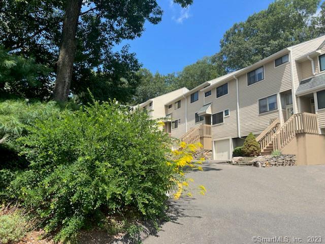 As chic as you can possibly get! This renovated 2 bedroom, 1.5 bath + garage townhome in sought after Sunrise Hill is reminiscent of a So-Ho loft - where tranquil scenery meets urban flair! Elegantly remodeled chef's kitchen w/under-cabinet lighting, stainless steel appliances, & all the cooking utensils one might ever dream of using! The Main Level has LVT luxury flooring throughout the Living Room, Dining Room, Kitchen, & Half Bath. The Upper Level with Bamboo flooring has a generous sized Primary Bedroom with closet space galore (3 closets w/ interior lighting and custom shelving racks) a 2nd Bedroom/Office with large closet, as well as a full updated Bath w/shower/tub combination. The Ground Level has plenty of storage, a washer & dryer, your own interior-access garage, & guest parking right at your door. Just outside the kitchen sliders is a private tree-lined deck where you can enjoy water views of the Long Island Sound in the distance. Beyond your backyard gate, there are gorgeous trails that encompass the perimeter of the complex that feature outdoor amenities including a tennis court, 2 pickleball courts, 2 playgrounds, a pool & spa, and charming gardens throughout. Fantastic commuter location close to I-95, Route 15, Route 7 & shopping. Landlord reserves attic for his own use. Good credit/work history a MUST & references req'd. Tenant pays for credit check. Come see this country-urban jewel of a townhome and prepare to be WOWED!!