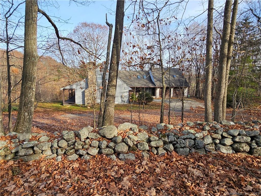 Opportunity knocks! 4.9 acres ! Three bedroom cape with main level in-law. Two car attached garage with storage above. Beautiful old barn, fruit trees and two ponds! Property is in an estate and being sold AS IS-WHERE IS