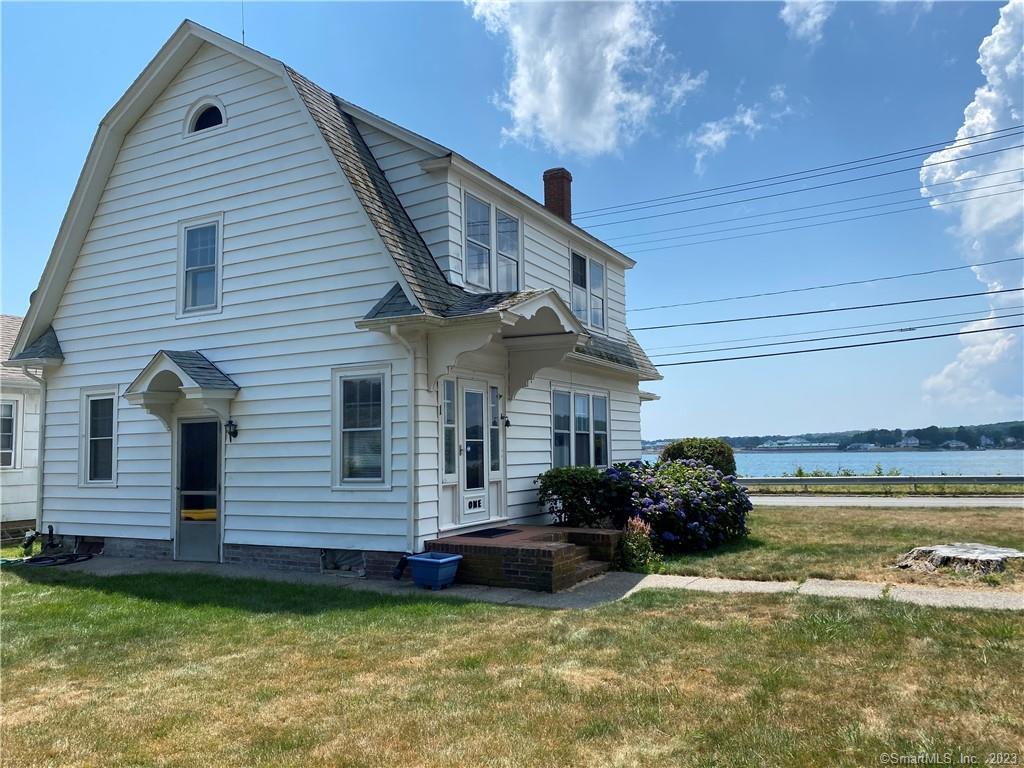 Three bedroom, one bath colonial with water views from the three season porch. Hardwood floors throughout and family room with FP.