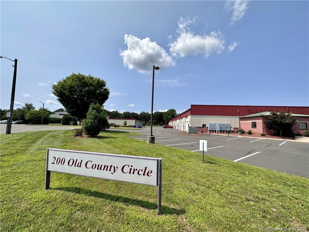 Industrial storage condos available for lease at 200 Old County Circle. 600sqft, 12ftW x 15ftH x 50ft Deep. 12ft overhead door. Electrical service and outlets at each unit. 200 Old County Circle has 24hr cameras for security, use of a dumpster, common office with kitchenette, ADA compliant bathroom, meeting area with WIFI ,and TV. Building 3 (#400's) was completed in 2020 and these available units have not been occupied, they're brand new.  Close proximity to BDL, I-91, RT. 20. Newly completed Amazon Distribution center, Fed Ex shipping center, and other national distribution/logistics center in the BDL/RT.20 Corridor . Perfect location for Business use, Distribution, Equipment, inventory storage, Personal use including Auto, RV, Boat, or just personal belongings. Sign a 24 month lease and get a month free!