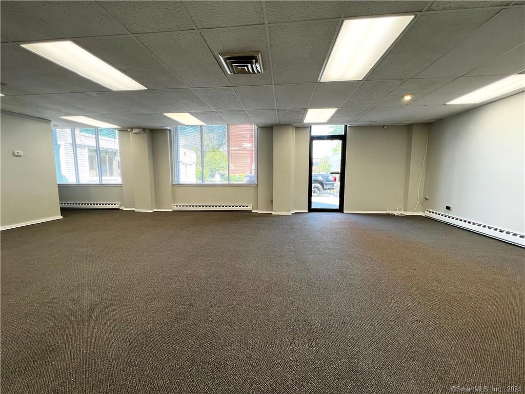 This large office/retail space located just 1/2 a block up from Main Street is ready for you and your business to move right in. This space offers 2,250 sq ft in total with 1,125 on each floor. You will also find 2 private office spaces, a private 1/2 bathroom, private entrance, 4 assigned parking spaces and 2 large open workspaces.