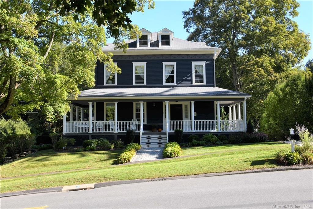 Charming and immaculately kept Victorian home with grand wrap around porch in fabulous location close to all that Woodbury has to offer. Beautifully furnished and ideal for entertaining and elegant dinner parties, this home has been lovingly maintained by the owner, with so many original details intact and professionally landscaped grounds. The main floor of the house has high ceilings, grand oversized pocket doors and gleaming hardwood floors. The spacious living room offers plentiful seating & includes a fireplace, built-ins and a grand piano. The large, elegant dining room is ideally suited to hosting large gatherings with plenty of space for guests to swarm about. The eat-in kitchen includes 2 ranges for the gourmet cook, a walk-in butler's pantry and access to a seasonal sun porch. Finishing off the main level are a powder room and both front and back staircases. The upper level includes 3 bedrooms, with a fourth room currently used as an office. The primary bedroom suite has a gas fireplace, spacious walk in closet and en-suite bathroom with a claw foot tub for soaking. There is an additional full bath in the hall. The house has central air, zoned heating and many ceiling fans. There is plenty of room outdoors to enjoy the professionally landscaped grounds, whether grilling out on the lovely gravel terrace, or relaxing under the wisteria-laden pergola. There is also a 2-car garage available to the tenant.