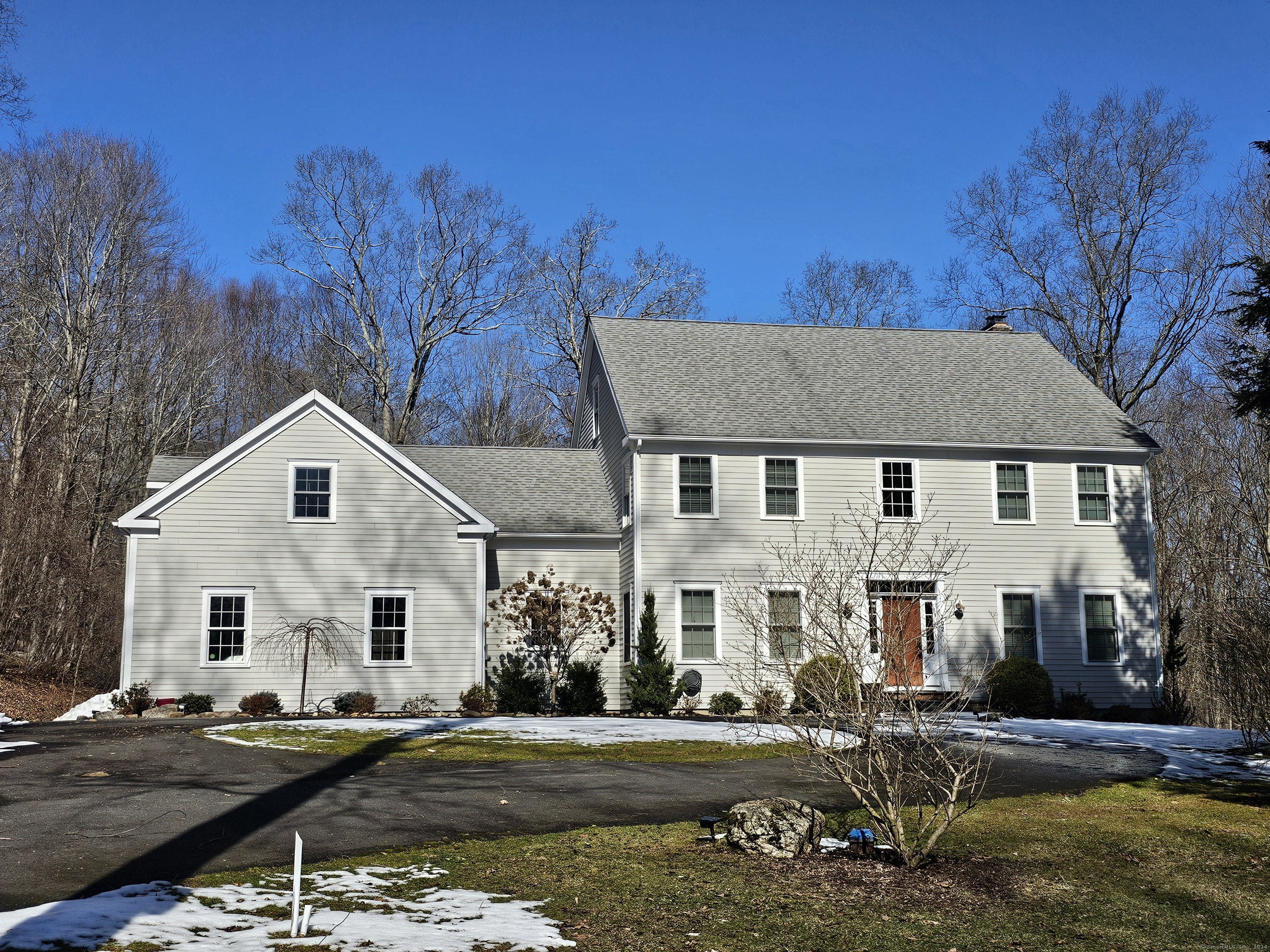 Pristine four bedroom home in private setting abutting land preserve. Over 2 acres of nature surrounds this home. Brand new fully equipped kitchen opens to an oversized family room with fireplace and built-ins. Formal living and dining rooms. Upper level features the Primary suite with walk in closet, full bath and fireplace. Additional three bedrooms, one en-suite and a bonus room complete the second level. Off the kitchen is the mudroom, laundry, half bath and three car garage. Plenty of space for all! Enjoy all that Litchfield County has to offer. Flanders Nature Center, Lake Quassapaug and Steep Rock, just to name a few. Minutes to great restaurants and shopping. Twice named the most charming small town in Connecticut by Reader's Digest. Just 90 minutes to NYC.