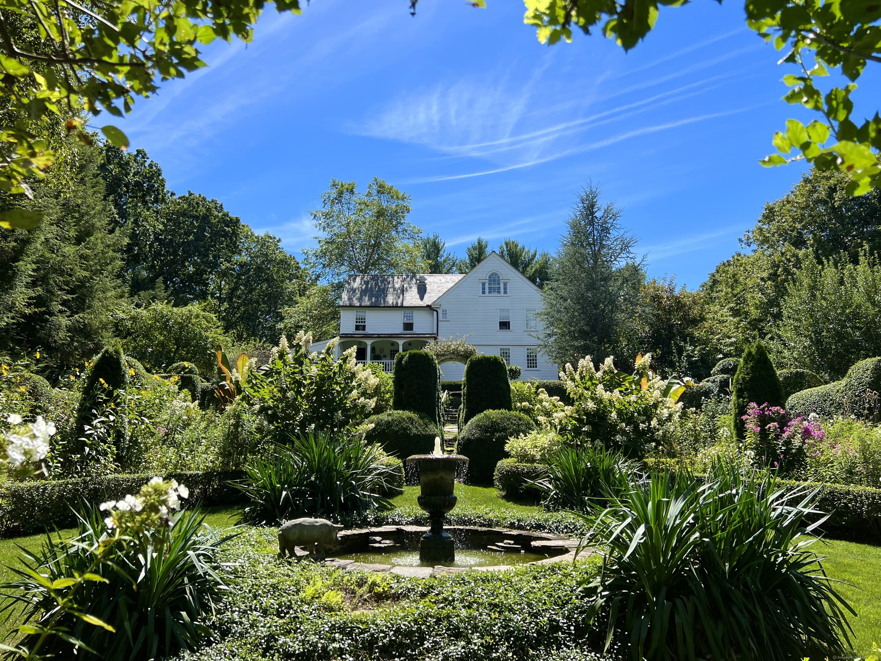 Incredible New Price! Welcome to the beautiful hamlet of Hadlyme, CT! This historic c.1732 home is the perfect blend of warm & inviting character of an antique home with all the modern systems & conveniences of today. Fully renovated and in perfect condition. Sited on 8.9 glorious acres, the backyard is the ideal spot to spend long lazy days dining on the granite terrace, soaking in the saltwater pool, while overlooking the gardens in great privacy! This exceptional home features 6 fireplaces, wood beamed high ceilings, and antique wood floors throughout. A bright open eat-in kitchen with a covered porch that overlooks the spectacular gardens, make this the perfect spot for morning coffee. The handsome library, spacious living room, wood paneled dining room all showcase fireplaces off the central chimney. The highlight of the main level may just be the warm, cozy, dreamy sunroom! The upper level opens to a large foyer which leads to the primary bedroom suite, 2nd bedroom (Or sitting room/office adjacent to the primary bedroom) & a 3rd bedroom with vaulted ceiling, flooded with light & with it's own full bath. The dramatic upper most level is the ideal spot for guests as it is a complete bedroom suite with full bath, vaulted ceiling & study. This one-of-a-kind property is like no other with a 2-car barn, potting shed, a woodland folly for candle-lit dinner parties by the fire pit, a second 2 car barn with chicken coop, an artist studio, & winding trails throughout.