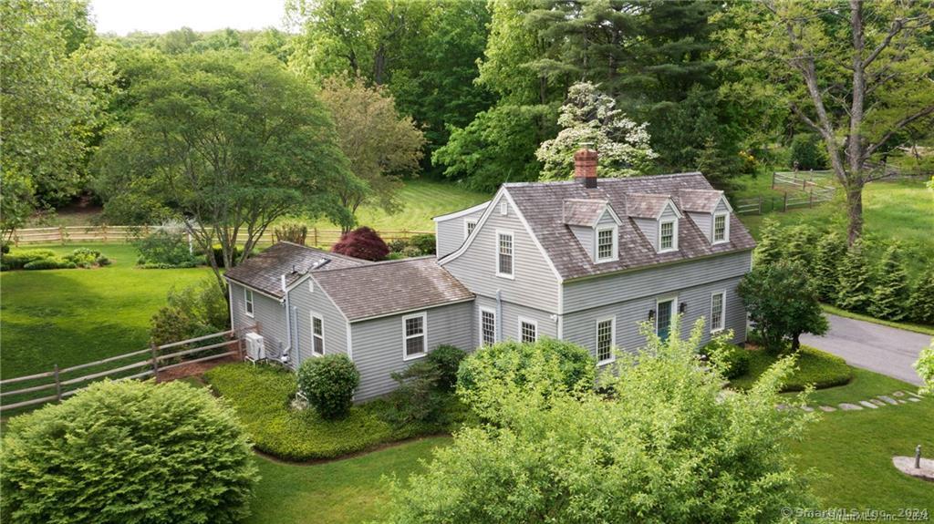 Woodbury CT, voted most charming town in CT by Readers Digest in 2018, 2020 and 2024! This Quintessential Cape is located in the historical section of Woodbury. The fully renovated and meticulously kept home is nestled on a level, perfectly landscaped yard, and offers an attached 2 car garage. Enjoy a convenient 1st floor primary, laundry and den on top of a living room, dining room and kitchen, plus walkout garage. A set up perfect for those seeking one level living. The Primary Suite sneaks private access to the courtyard garden, and features its own renovated bathroom, double closets, and a picture window overlooking the luscious landscape. The second floor offers 2 bedrooms, each with their own generously sized dressing room (or office), both connected by an updated Jack and Jill bathroom. The home is energy efficient with ductless heat pumps throughout the home, creating centralized warm or cool spaces and is connected to a whole house generator. Conveniences of Miele Washer/Dryer, Bosch Dishwasher, Bosch Fridge, Gas Stove and Alarm System. The handsome exterior greets you with mature landscape, a simple patio, copper gutters, railing fence, and a storage shed. Located five minutes from I84, and 90 minutes from NYC. This home is privately tucked away right off of CT's famous antique trail, which offers tasteful shops and restaurants, giving you quick access to indulge in the many amenities, and beauty which Woodbury has to offer. Credit/Background check. No pets/smoking.