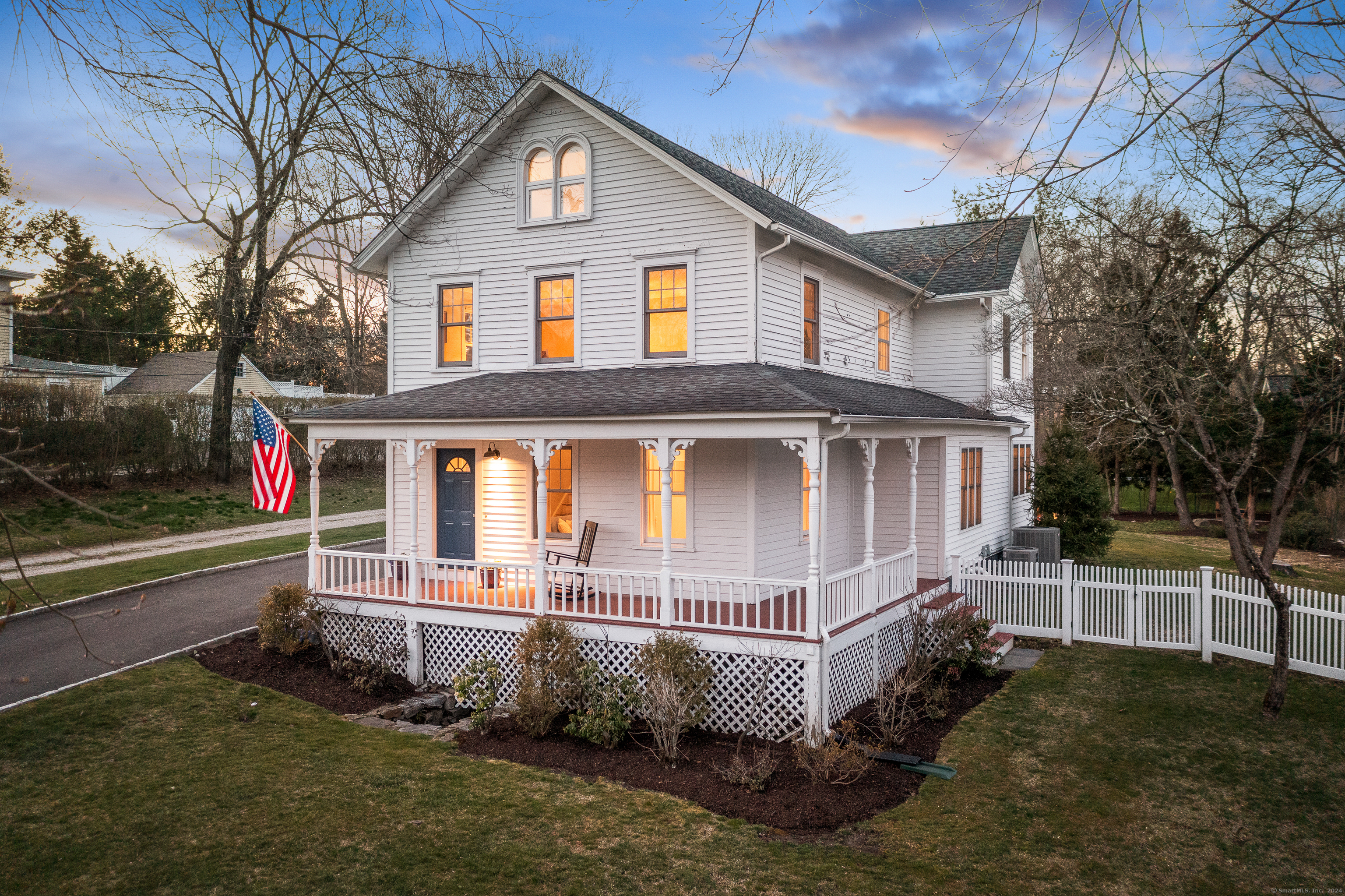Set in the heart of Westport's Saugatuck Village, this updated and expanded 1890s farmhouse combines charm with an unbeatable location, just moments from riverfront cafes, restaurants, and the MetroNorth train to NYC. The wrap-around porch welcomes you to a sunny living room that seamlessly flows into a family room with hardwood floors throughout. The eat-in kitchen boasts a gas range, granite island, extra pantry storage, and picturesque backyard views.The main floor also includes a half bath, plus office with custom desks and built-ins, perfect for work or study. The mudroom provides easy access to the sunny deck, ideal for grilling, dining, or lounging. Upstairs, the luxury primary suite has a walk-in closet, plus ensuite bathroom with double sinks, a soaking tub, and luxurious walk-in shower. Two additional bedrooms and a hall bath complete this floor. The finished third floor provides versatility with space for overnight guests, a study, or working out. Outside, the flat yard is framed by a tranquil brook and bridge with seating area, plus plenty of grassy lawn for play. The detached 1-car garage and fully fenced yard offer both convenience and privacy. Westport's award-winning schools are nearby, and Compo Beach and downtown shops are just a short ride away, as well as access to 95 and the Merritt Parkway. **OFFERS DUE 4/8/24 by 3pm**