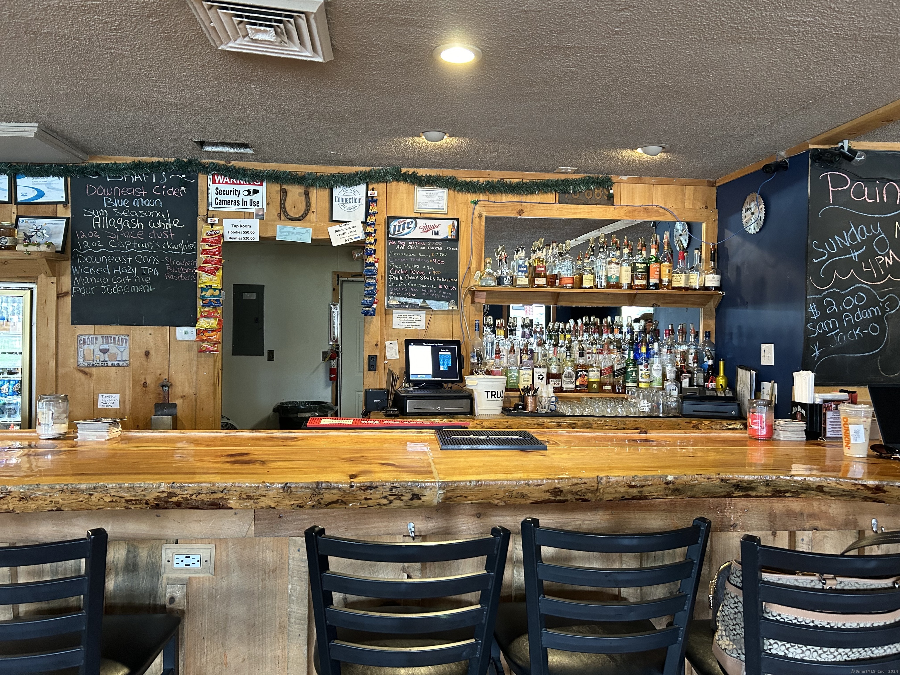 Here is your opportunity to own a well-established bar & cafe in New London County. This turnkey business has a reputation for great drinks, food, entertainment, and Service! Over the past 8 years, the current owner has offered cafe style food (wings, French fries, egg rolls, quesadillas etc.), Happy Hour, Entertainment (karaoke, live music, paint nights, DJ)! Along with food and drink sales, additional income is produced from commissions for Jukebox, 6 pool tables and ATM machine. This establishment has a loyal local following thanks to their excellent service. The venue is spacious, featuring a main bar area, low-top tables, chairs, high-top tables, and a kitchen. The owner is willing to stay on to train new buyers, if needed. Bartenders are willing to stay on as employees if new buyer's request.