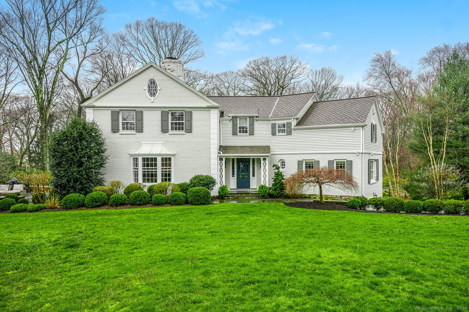 Welcome Home to 761 Round Hill Rd! Quintessential 1940 Colonial treasure is a unique combination of charm & sophistication AND a coveted 1.24ac Winton Park setting. Inviting & well maintained 4 Bdrm, 3.5 Ba home w/just under 4,000sq ft is a delight & a wonderful place to entertain in every season. Traditional features such as hardwood floors, custom built-ins & generous moldings accent well proportioned rooms to offer a gracious & warm appeal throughout. The Living Rm is architecturally bold w/a wood burning fpl, bookshelves & natural light pouring in the bow window. Enjoy holiday celebrations or intimate dinners in the Dining Rm or the E-I-K complete w/generous cabinetry, Wet Bar & a view of the picturesque property. Finishing off the Main Level is the Den, a quiet place to work from home or enjoy a movie night. Relax w/your morning coffee in the Sunroom or continue out to the stone patio & feel your blood pressure drop as you soak in the spectacular greenery & gardens. The 2nd floor offers the Primary Suite w/generous his & hers closets & a private Balcony overlooking the Patio & Gardens. 3 addt'l Bdrms are generously sized w/2 Full Ba. LL Rec/Playrm combines beautifully w/Laundry Rm, Mudrm & loads of closet space to handle your active lifestyle. 5 ways to access the outdoor Patio, Decks, Garage & backyd not to mention the "Man Cave" or "She Shed" of your dreams! Minutes to everything downtown Fairfield has to offer.