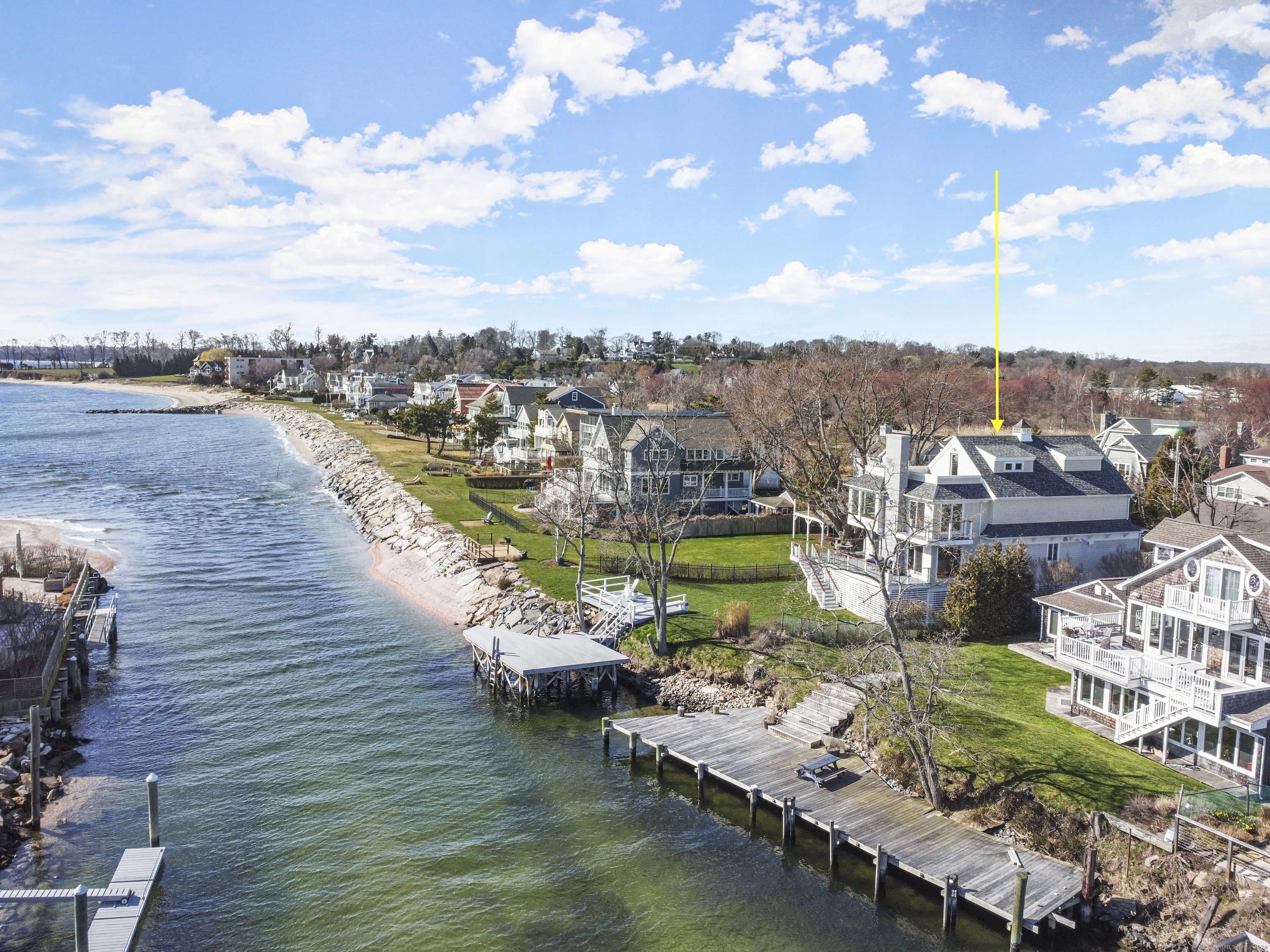 Vacation All Year Round! Direct Waterfront Home with Separate 2BR Cottage offers endless LI Sound views, large dock and spectacular sunsets. #320 (Main House) was beautifully built in 2018 and is 100% FEMA compliant. This perfect beach home is a light filled 4BR/4Bath, direct waterfront dream with deep water dock and direct access to both the Sound and Creek. The gourmet kitchen and great room seamlessly bring the outside in and flow onto the spacious wrap around deck, ideal for entertaining and dining. The luxurious primary suite with gas fireplace and floor to ceiling panoramic views offers endless tranquility while the finished 3rd floor space with outdoor deck and hookup for hot tub provides lots of hangout options. 3 additional private bedrooms with 3 full baths, including a 1st floor bedroom option which also works beautifully as an office. A 3 car garage underneath with plenty of storage for kayaks and paddle boards offers endless possibilities. #318 (Cottage) is an additional 832+sqft 2BR/1Bath guest cottage and provides tons of options as either an additional living space or as an income producing investment. Cottage is currently rented thru June 2024. .32 acres provides for privacy and completes the premium beach location.