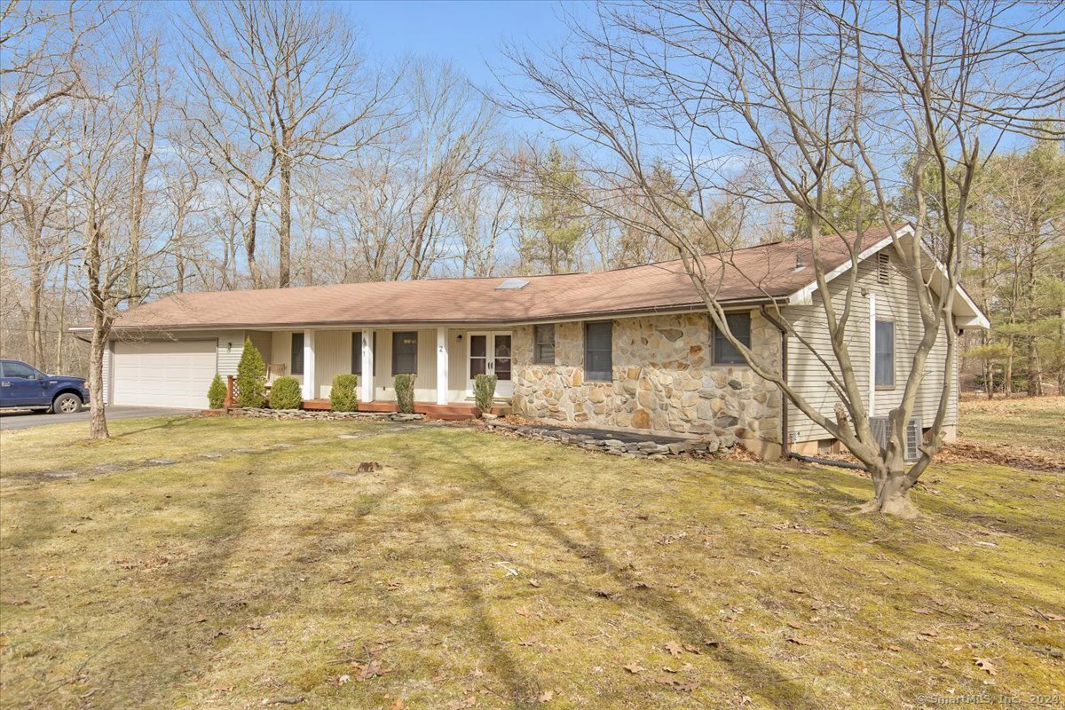 Come see this 3 bedroom, 2.5 bathroom, 2 car garage ranch in the quiet of beautiful Tolland! This home welcomes you with an open floor plan dining room, kitchen, and a cozy sunken living room complete with a massive stone fireplace and wood stove. The kitchen has stainless steel appliances, a breakfast bar, and granite countertops. Off the dining room is an additional room perfect for a private home office or playroom. The kitchen also has the convenience of a guest half bath and laundry room. Down the hallway are the 3 good sized bedrooms along with one full bathroom, the master bathroom, and the master walk-in closet. The sliding glass door in the living room leads to the backyard with many great options for entertaining. The screened-in gazebo has a ceiling fan, there is a built-in outdoor fireplace, and the full acre lawn is a great space for games. This house also has central air and full basement with plenty of storage.