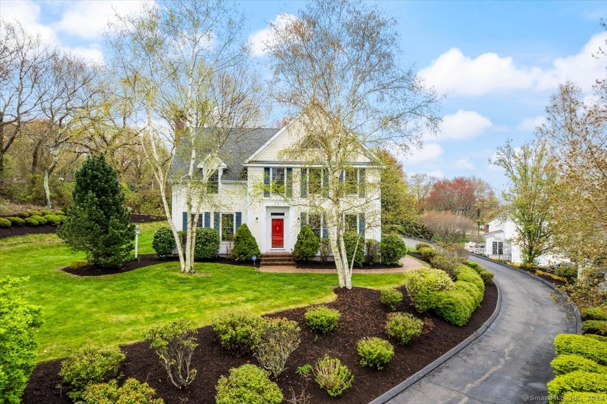Enjoy this beautiful Colonial home nestled within the small seaside coastal village of Noank in the desirable Crosswinds neighborhood! This expansive home offers 3,132 sf with 4 bedrooms, 3 full and 1 half baths, and sits on just under an acre lot. Upon entering, you are greeted with a nice entryway and an attractive staircase that leads to the upstairs bedrooms. Walk through the French doors on your left and you are met with an expansive living room that displays a gas fireplace and provides direct access to the two-story sunroom! Adjacent to the front entryway and through the French doors, you are presented with the family room. You will enjoy the spacious eat-in kitchen and dining area for everyday casual dining and has plenty of open space for social gatherings. Off the kitchen is an elegant formal dining room showcasing a beautiful bay window and decorative ceiling medallion. On the second level are 3 bedrooms, two bedrooms share a Jack and Jill bath. Primary has a tray ceiling, walk-in closet, a private full bath and sliders that open to the two-story sunroom. There's also a large private bonus bedroom on the third level with a half bath, Palladian window and built-ins. Residence is well maintained and displays a lovely, landscaped exterior. It features a full basement, central air, automatic start generator, and a two-car garage. Become a part of this wonderful water community. It is close to several five-star restaurants, parks, marinas, beaches and downtown Mystic.