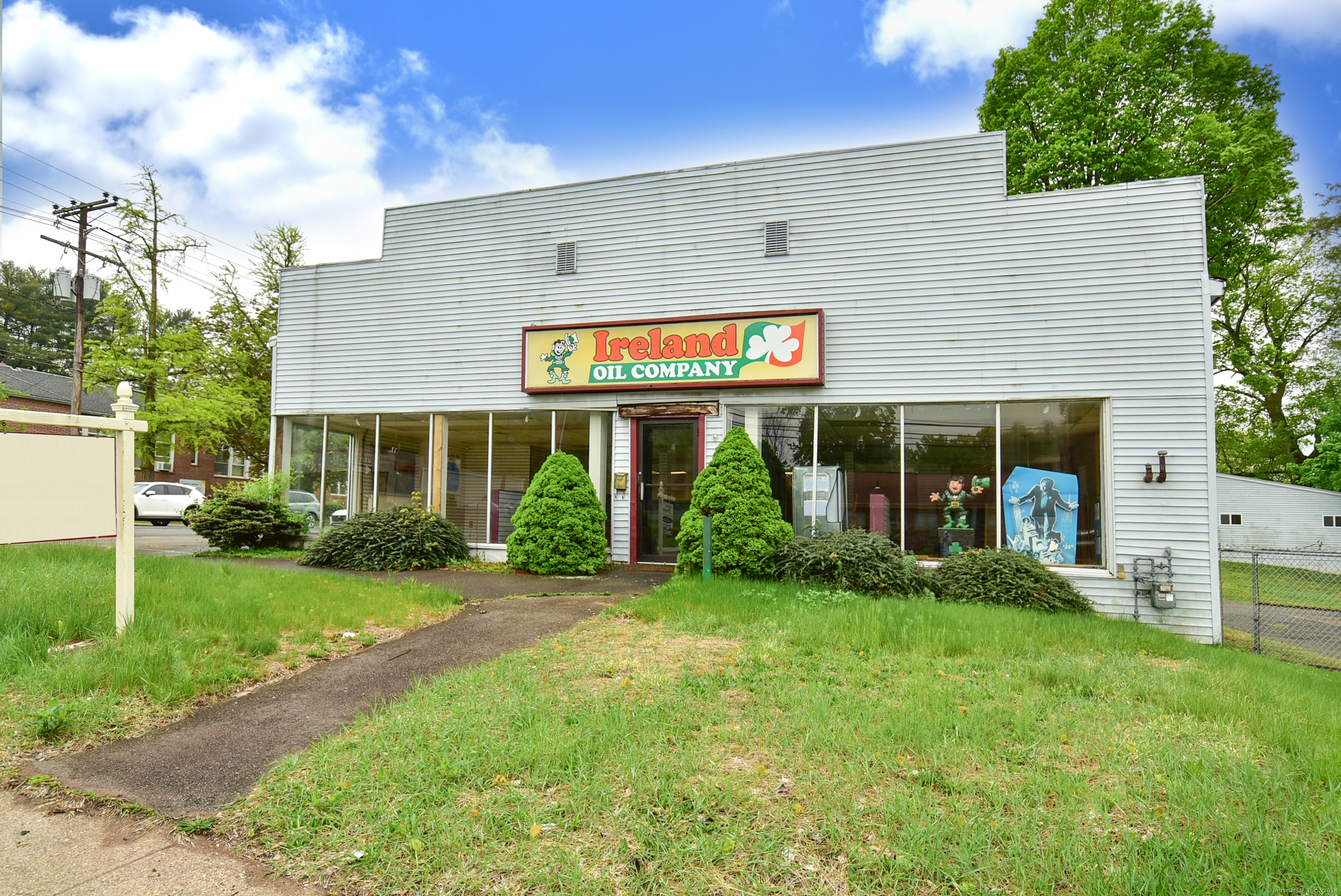 Great building with main street exposure. display room, Office area, and two car tandem garage. Natural gas and oil heating, as well as air conditioning. Plenty of parking for customers, clients, and employees.  Possible Residential Use, plus commercial uses as listed in NR-10 zone. Special Permit uses are available.