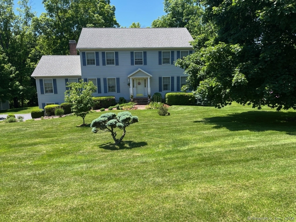 Classic Center Hall Colonial updated and meticulously maintained, in a quiet neighborhood only minutes from Candlewood Lake and I-84. There are 4 Bedrooms, 2.5 baths, a spacious 2 car garage. In addition to the 3284 sqft of living space the home has an attractive basement with full size windows, and a door to the outside. It's a nice additional space for play, having a party, or to relax. The large 2 car garage has an attached mudroom. The master bedroom has a walk-in closet, a large bathroom with onyx tile floors, and a large double headed shower. The family room has a gas fireplace, while all rooms are bright and sunny. The deck has a motorized awning with gorgeous views of 1+ wooded acre property. There are too many more sought-after amenities to list, this home may go quickly.