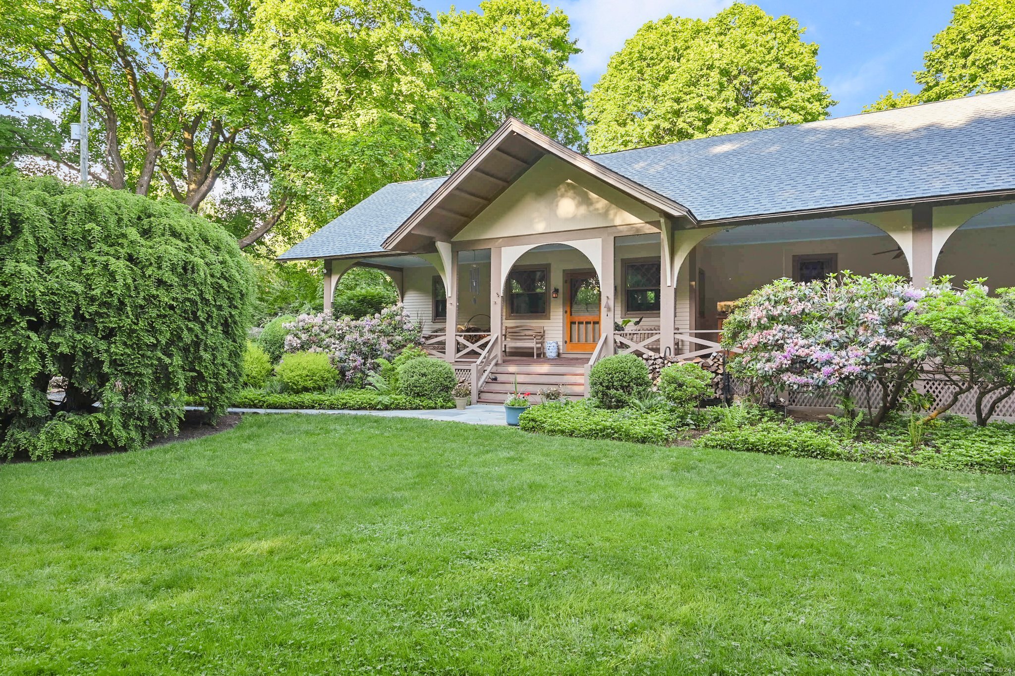 One of the earliest known surviving examples of Craftsman architecture in Redding, this rambling 1906 ARTS&CRAFTS home, w/ 2003, 2, 000-sf addition. 7+ private level acres w/professional landscaping. English cottage style diamond paned windows; hand-cut mission woodwork; board & batten wainscoting; irregular rooflines; overhanging eaves and a 72' front porch. 4 original floor-to-ceiling fieldstone fireplaces in the spacious Living, Dining & Music rooms. Cozy Library/Office w/built-in bookshelves. Large sunny country Kitchen w/white leaded glass front cabinets; island; limestone counters; stainless appliances; adjacent butler's pantry & milled antique barn wood floor. Oversized main floor primary Bedroom suite w/french doors to patio overlooking back property, Brazilian cherry floor; travertine marble in bath, dressing area plus 2 walk-in closets. 2 staircases to add'l Bedrooms plus a Playroom/Office & a 38' wood paneled Game room. Outbuildings include a detached 2-car garage & workshop w/1-bedroom apartment above, well house, garden shed, bunk house. Charming original raised stone patio, stone walls, specimen & fruit trees, perennial gardens including iris and peony, fenced vegetable garden w/raised beds & potential pool sites; possible horse property. Walk to Lonetown Marsh for birdwatching & winter ice skating and concerts on the green at Town Center. This enchanting, very peaceful country retreat is minutes from trains, shops, restaurants and only 60 miles from NYC.