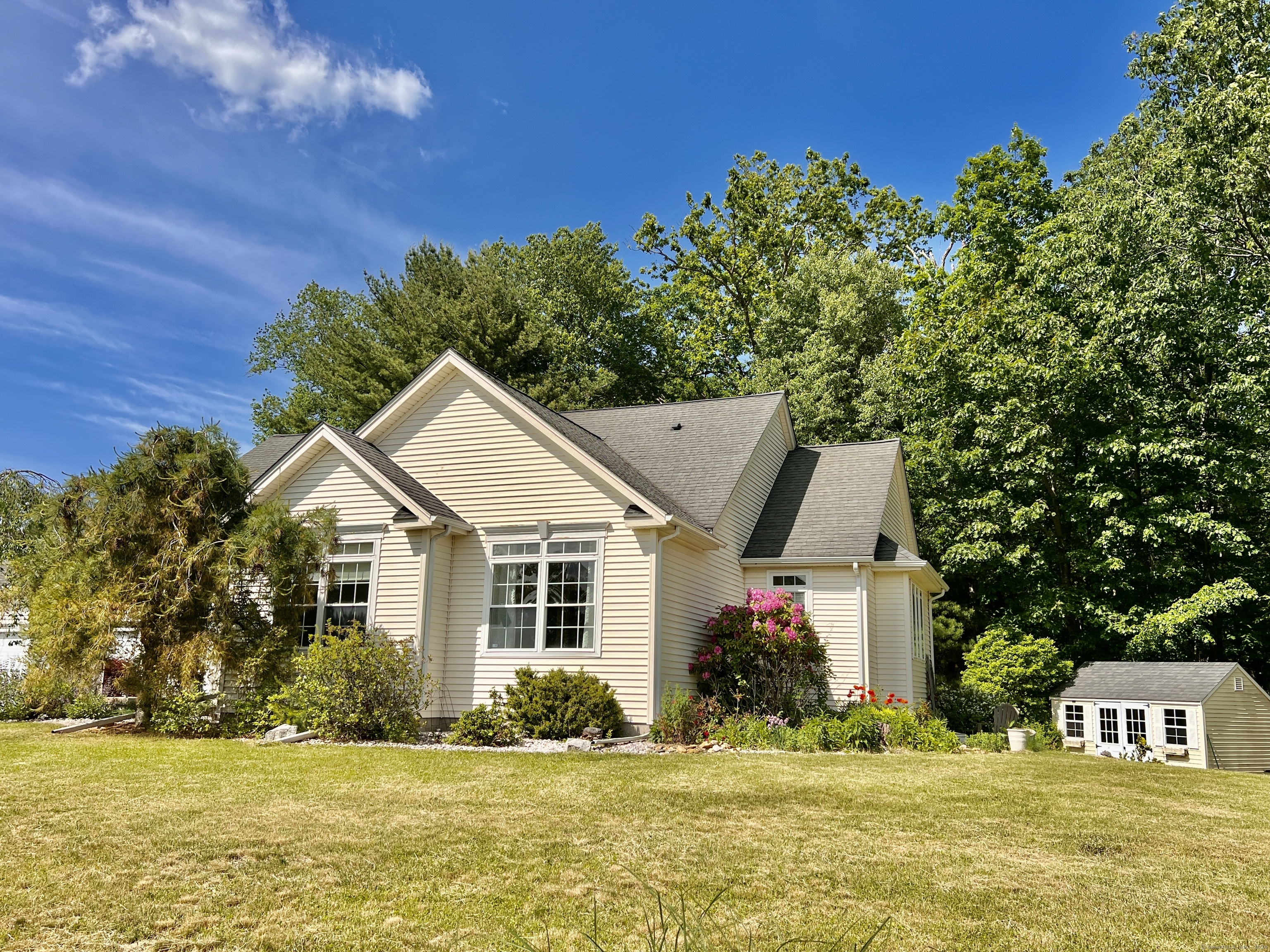 Peace and serenity await at 38 Homestead Drive in Mansfield. This wonderful home is just a five-minute drive to the University of Connecticut Campus and Downtown Storrs Center. This amazing opportunity that is seldom available in this quiet sub division. Set on just over one acre, th newly planted pollinator-friendly shrubs and perennials complement the manicured yard. This home offers one-level living at its best. There are two and a half bathrooms, a spacious primary bathroom with a separate shower, and a jetted soaking tub. There is a large primary bedroom, two additional nice-sized bedrooms, and a heated bonus family room with an office space in the lower level. You will find plenty of storage in the basement and a workstation in the two-car garage. This home has been lovingly maintained and the most recent updates include: Bathroom and Kitchen Vents were vented through the roof in 2018. New Greensand Filter installed in 2019. Generator Hook up installed in 2019 Newly Painted in 2020. New Hot Water Tank installed in 2022.