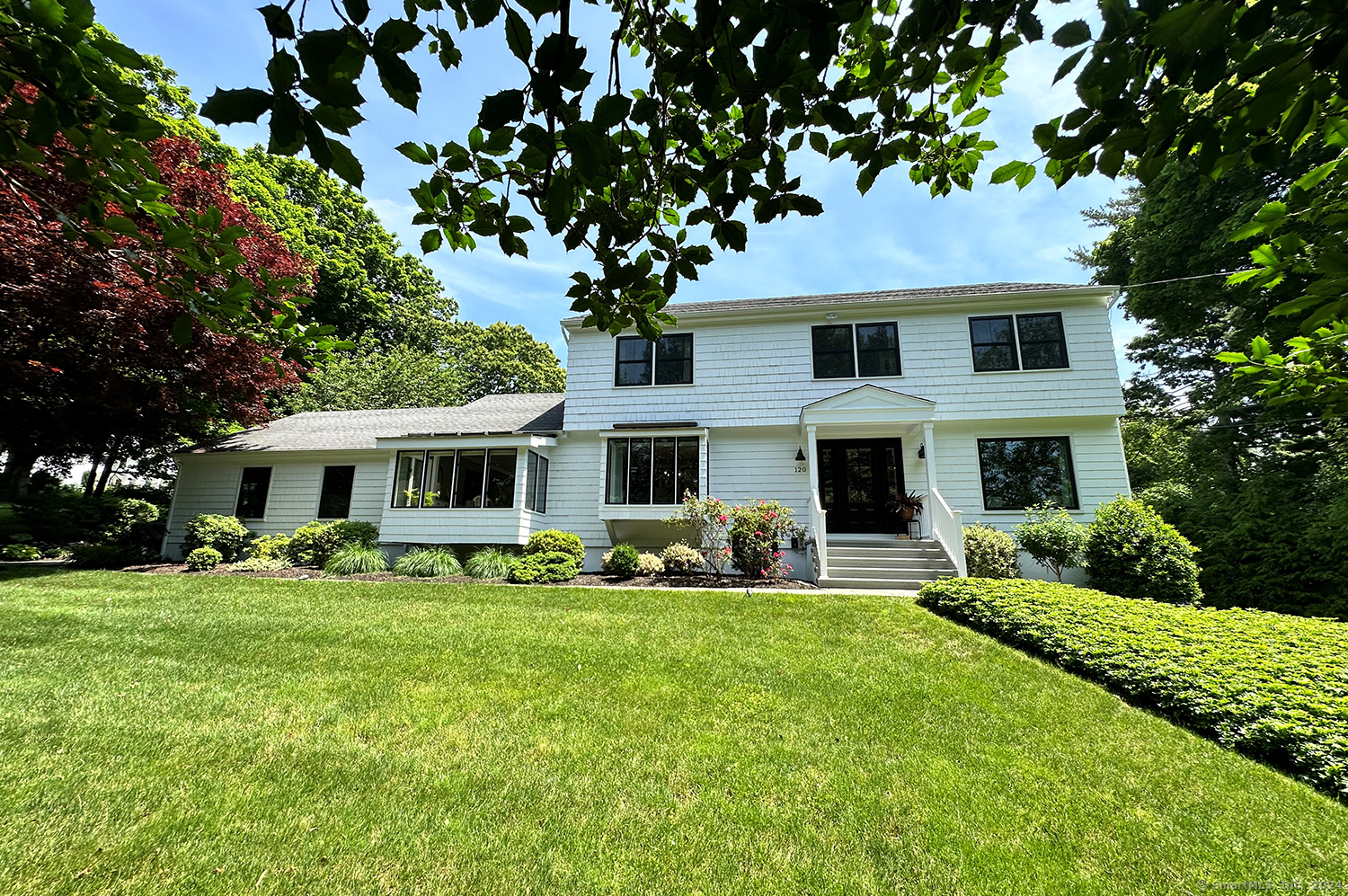 This beautiful colonial is located in one of the most peaceful and private settings in the neighborhood.  Situated on a cul de sac, this home has all the updates imaginable. Open floor plan allows for easy living, with a large living room, family room, spacious dining area, plus EIK in open plan kitchen with serving bar.  The kitchen has new shaker cabinets, quartz counter tops and farm sink. The main level has two sets of french doors, wood burning fireplace and hardwood floors throughout.  Primary bedroom has walkin closet and updated full bath. Updated full bath for additional bedrooms located on upper level. Lots of natural light streaming in all day. New Anderson windows and fresh exterior paint make this home move in ready. Additional cottage and jacuzzi tub add to the outdoor space, with new trex decking and large stone patio. This is your very own retreat. Home theater and additional play room on the lower level, which also has plenty of storage and a direct walk-out. This home is also a Smart Home - lights, temperature and TV can be controlled from your iphone. There is nothing to be done but move in and make this home your own.
