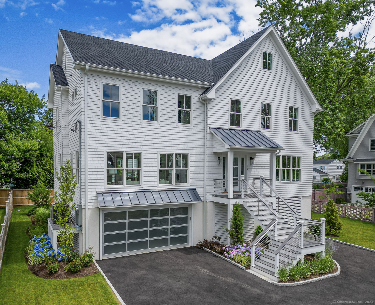 Stunning Coastal New Construction home. Live the beach lifestyle! This home sits on a sleepy little street just steps to beach & park and a short walk to marina, schools, downtown, train, farmers market, live music & more. 4000 sq.ft+, w/5 bdrms (4 bdrms on 2nd level) & 4.5 bthrms. Professionally designed w/exceptional finishes, 9' ceilings, beefy moldings, open floor plan, light-filled & extremely generous room sizes. Three finished levels include a sleek chefs kit w/10' island, quartz counters, top of the line Thermador appl's w/custom cabinet panels, touch open Frig w/SS interior, 6 burner gas cook w/griddle, butlers w/large walk-in pantry, great rm w/flr to ceiling tiled gas fpl, dreamy master w/gas fpl & 2 walk-in closets, stunning luxury bth w/heated flr features 10' vanity w/quartz, lrg laundry rm, 3rd flr offers full ceiling height w/ media/playrm w/ wetbar, designated office space w/private balcony, 5th bdrm & full bthrm (great for guest or home office suite).LL loggia, fab for in/outdoor liv, w/sliding barn door leads to your entertaining patio & cedar fenced yard (room for a POOL) w/irrigation & prof. landscape. Huge ground level mudrm, 2 car garage (upgrade option for 3rd bay), tons of storage & circular driveway. FEMA compliant! Gorgeous 4" white oak flr, Kohler & Rohl plumbing, Chloe Winston & Arteriors lighting, prof. outfitted closets, wired for audio & generator, designer tile, high efficiency multi-zone heating & cooling, tankless water, spray foam & more