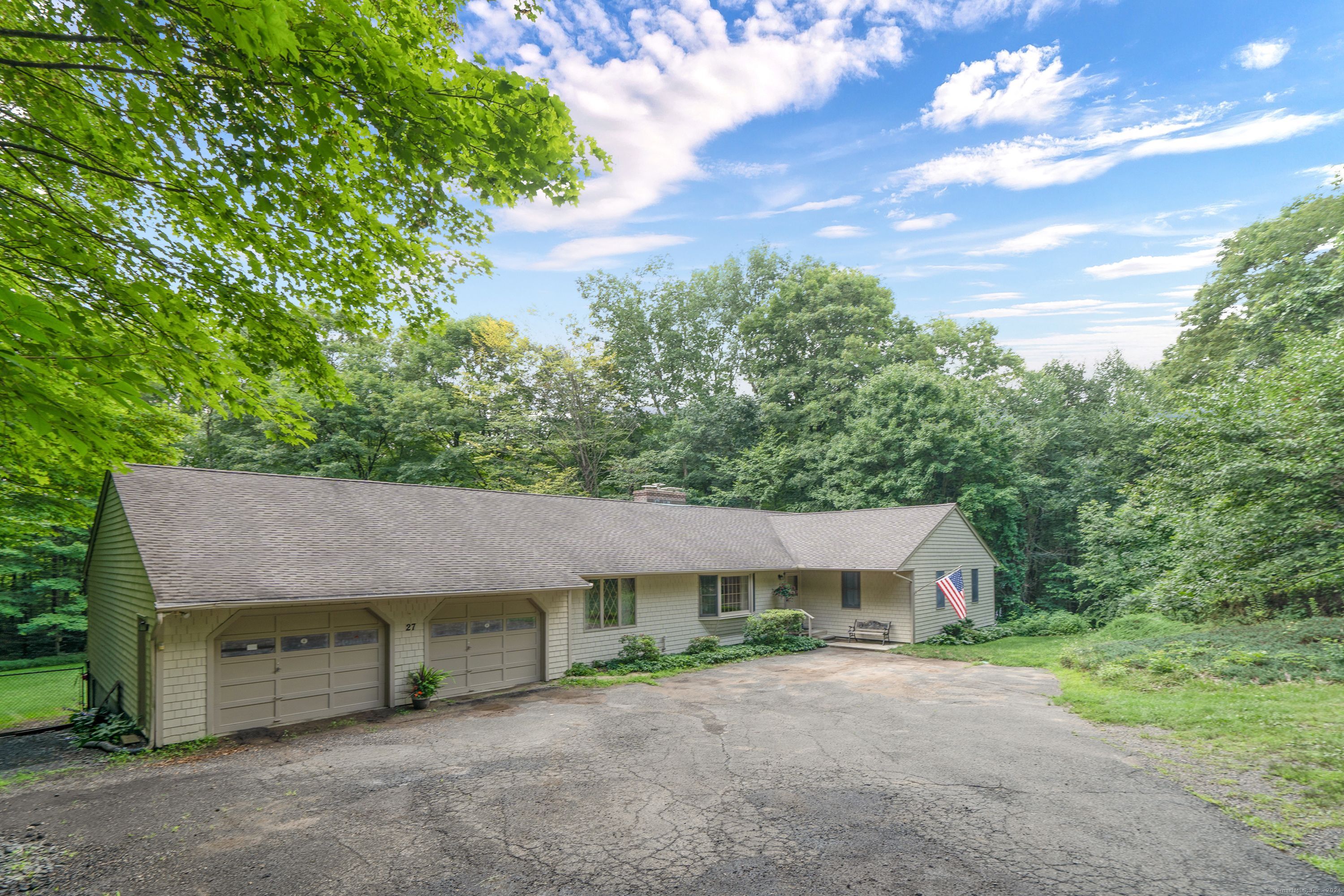 Privately set and just a little out of the way sits this well built ranch on 11.4 wooded acres with stone walls and a gentle stream. Property borders 119 acre Roxbury Land Trust. Simple as it seems, it's a perfect place to get out of dodge. Having relatives in the construction business, this home was constructed with Quality, Quality, Quality with energy efficiency in mind. A 3 acre parcel encompasses the driveway you share with two other homes along with the maintenance too. One level with a wonderful floor plan for easy living and a walk up to the storage above if you ever want to put on a second story that it's built for. Windows and doors are Andersons and the furnace is only 2 years old. New AC in 2021. New water heater in 2024. Generator hook up and plywood subsiding for clean living. Beautiful brick fireplace, hardwood floors. They have built the canvas, now you can add the color and decor. Come enjoy the peace and quiet this property has to offer.