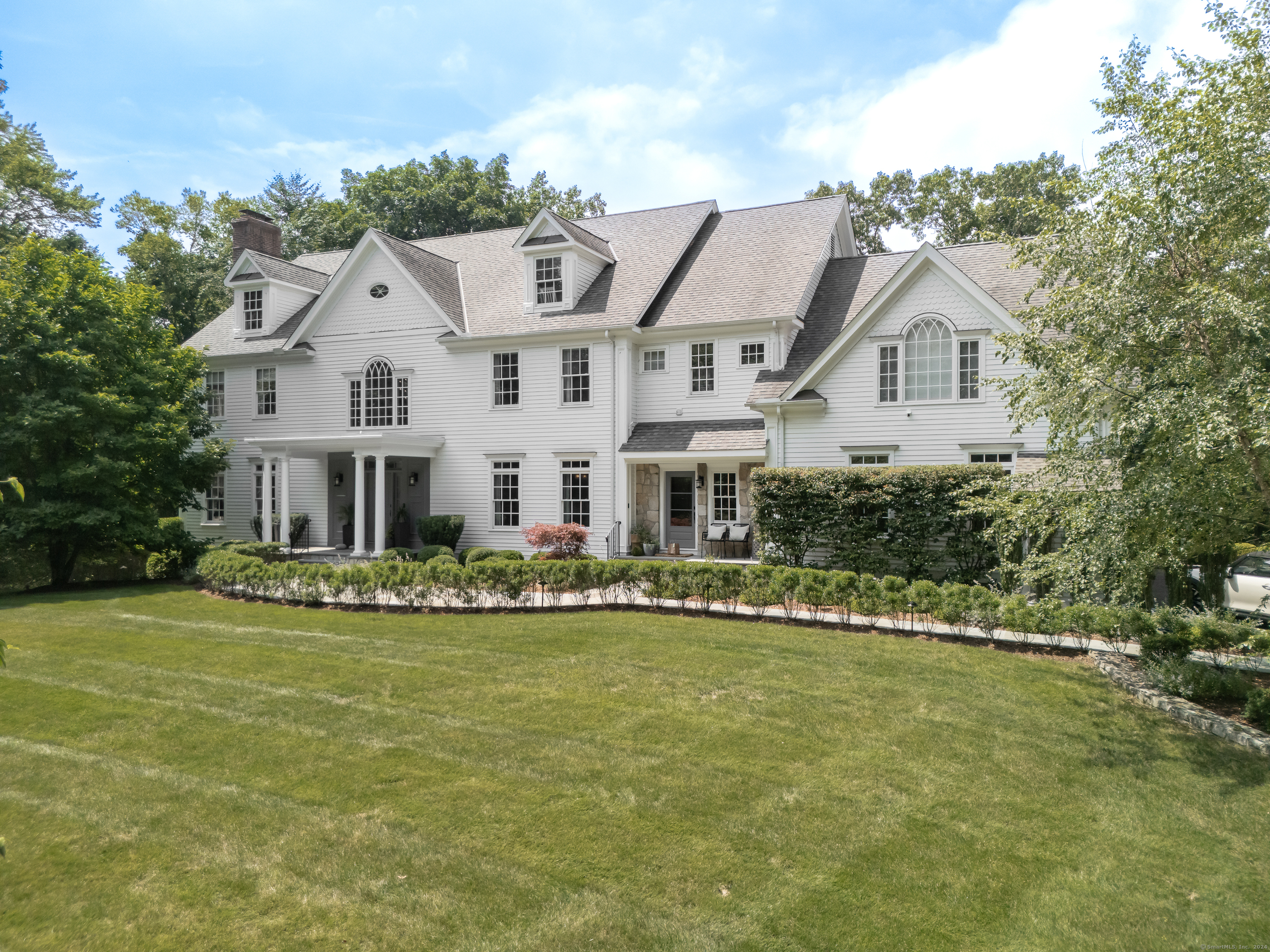 Thrilled to present 5 Timber Lane - a stunning custom Colonial situated on 1.6 acres, offering one complete privacy, yet a stone's throw from the finest shopping, dining and beaches that makes Westport so desirable. Imagined and decorated by acclaimed designer/owner, the passionate attention to detail throughout is evident: from the main level soaring double height entry, to the inviting living room with wood burning fireplace, to a formal dining room enveloped in suede wall coverings, luxurious drapes and a butler's pantry. Pass by the den, with its lacquered walls and ceiling, hidden safe and art gallery shelving - it's a space you can envision James Bond lounging in. En route to the kitchen is a Parisian-inspired mirrored bar. The chef's kitchen is what you would demand - quartz/granite abound, Thermador appliances. An open-concept floor plan seamlessly blending indoor and outdoor spaces. The outdoor is meticulous from its perfectly manicured grounds - with abundant space for pool - stone patio, full Viking kitchen. The spacious master suite epitomizes luxury with a fireplace, soaking tub and vaulted ceiling. 3 additional bedrooms, each en-suite, are located on this level along with a media room equipped with state of the art technology. The walk out lower level has the home's guest suite, home office/studio. A sommelier-quality custom cellar to showcase the finest of wine collections. This home truly needs to be seen to be fully appreciated.