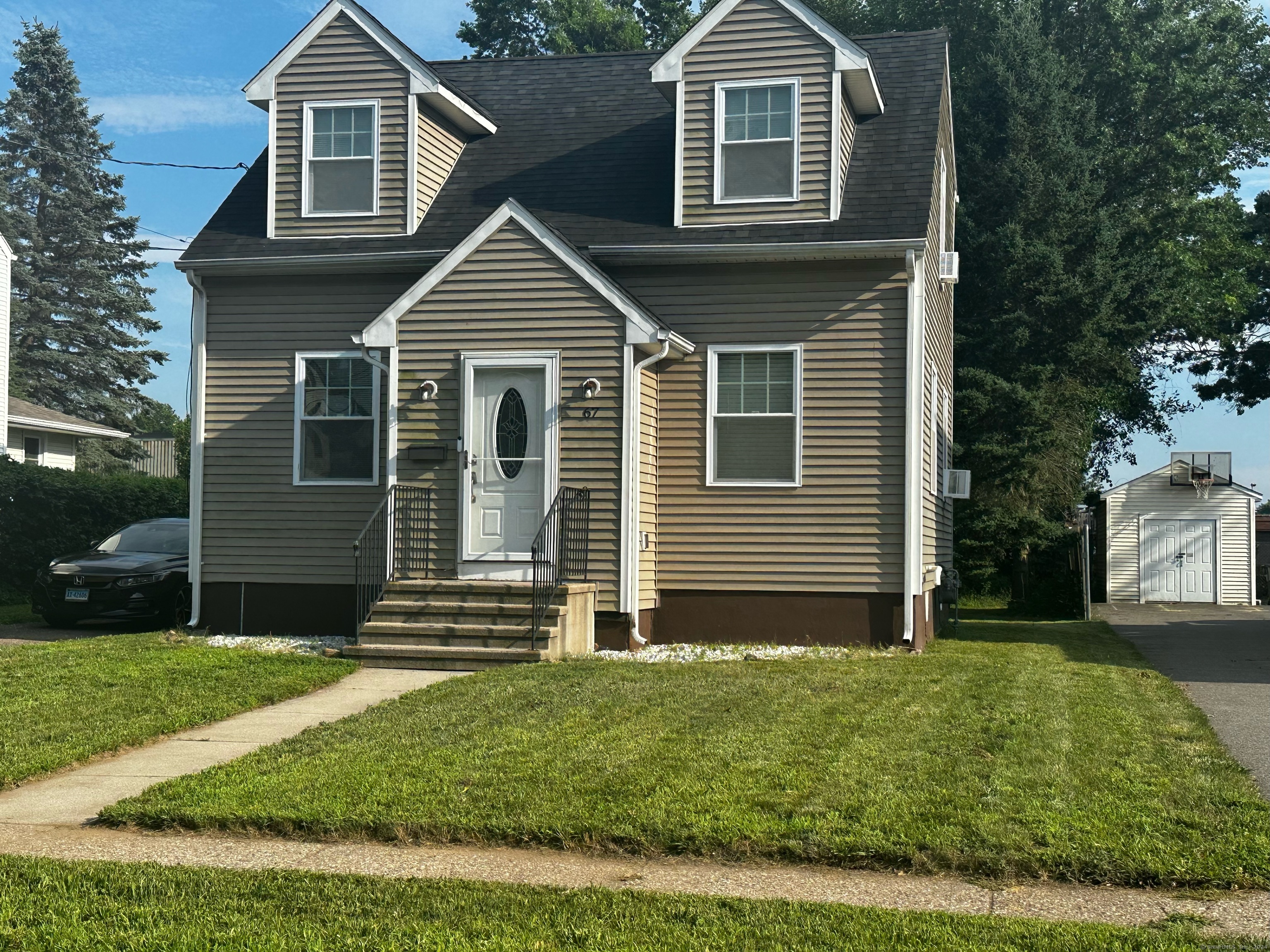 Welcome to this delightful two-bedroom, one-bath cape nestled in the heart of East Hartford, Connecticut. This charming home offers 1, 100 square feet of comfortable living space, perfect for first-time home buyers or those looking to downsize without sacrificing comfort. s you step inside, you'll be greeted by a warm and inviting atmosphere. The spacious living room features ample natural light, creating a bright and cheerful environment. The kitchen is efficiently designed with plenty of cabinet space, making meal preparation a breeze. Both bedrooms are generously sized, offering peaceful retreats for rest and relaxation. The single bathroom is well-appointed and conveniently located to serve both bedrooms and guests. Special Features Include Gas Heat: Enjoy the efficiency and reliability of gas heating throughout the colder months. Cape Cod Style: Classic architectural features that exude charm and character.