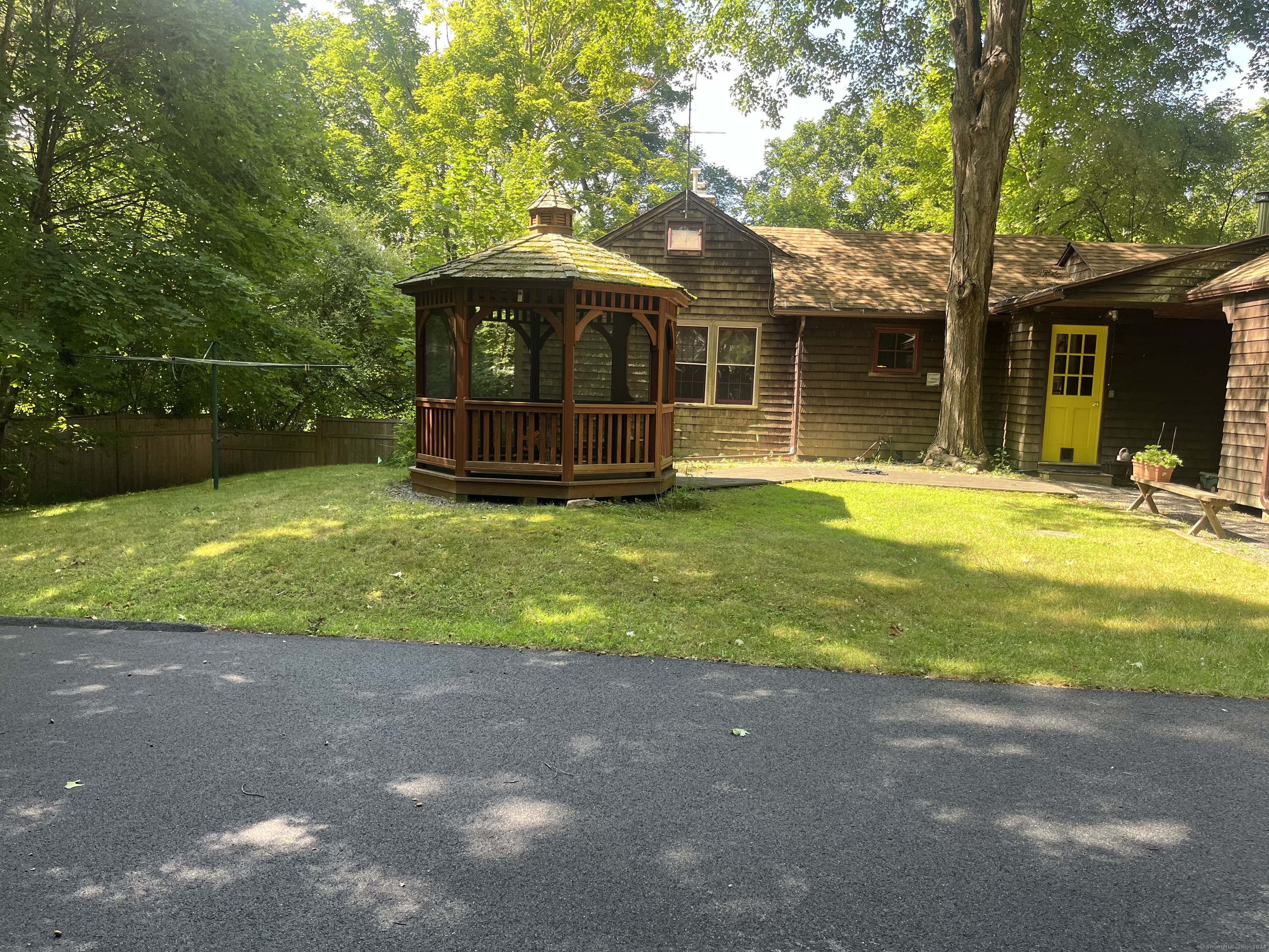 This wonderful little home needs complete renovation on the interior but it is ready to be a gem! It has a newer roof, separate barn/garage, wonderful cedar shingles, generator, 2 separate storage sheds, an attached 24x11 workshop, privacy fencing, wooded hill along the side boundary for great privacy and so much more! The Strong Preserve is located at the end of this short road and a large corn field is adjacent. This home is located in the village of Woodbury within walking distance to schools, library, coffee shops, restaurants, sidewalks, hiking trails, park and playgrounds, community theater, community outdoor concerts and so much more. Reader's Digest again named Woodbury Best Small Town in Connecticut and the Sunday New York Times Living In section called Woodbury Peace, Quaint Beauty and a Sense of History. Located only 10 minutes to I-84, 1/2 hr to the train station and 1 1/2 hr by car to NYC.