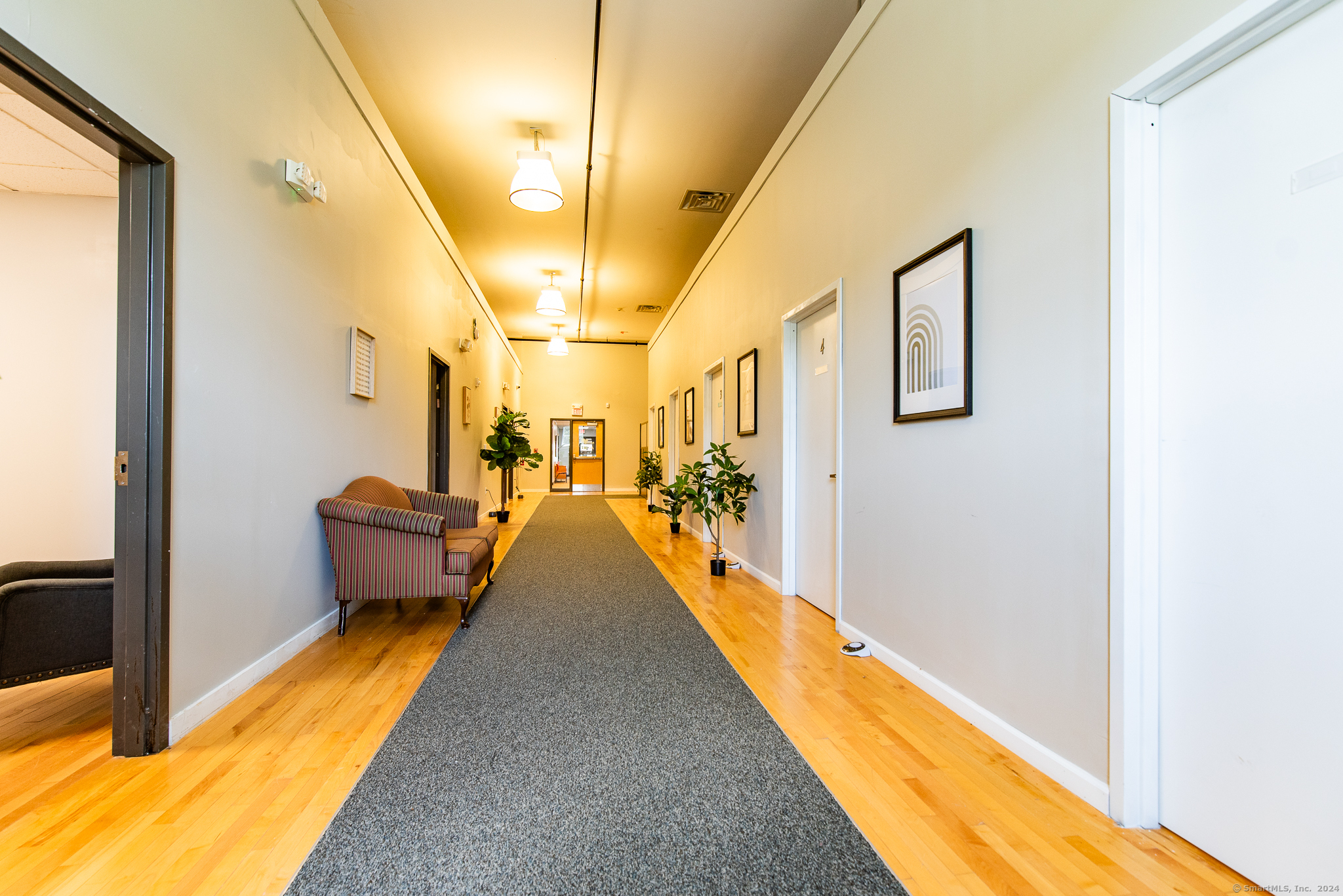 The property is located in the heart of the downtown business district of Willimantic. The building recently renovated in 2022 has created an above grade versatile facility. This offer includes the (Lower Level 9834 SF) and (1st FLR 11120 SF) 20958 SF. The (Lower Level) space includes a secure private entrance from Riverside Drive with a reception area and office, 5 versatile offices, conference room, Recreational fitness auditorium with 8 offices, elevator access, ADA accessible, security system, private gender restrooms, Central air conditioning climate control and plenty of Public parking. The 1st FLR 10693 FS with the most recent renovations offers 3 separate use specific areas to accommodate multiple programs or services all at one location. Area 1- 16 office layout, lounge area and kitchen. Area 2 - Administrative offices and meeting rooms and Area 3- Reception and easy access service area (See Floor plan and photos). Ideal for Corporate training and education, Behavioral services, Medical services, Doctors office or other specialty services. The offering is a 1-5-year base net lease at $12.00 per SF (Below Market). Utilities and CAM charges negotiable. Note each floor has separate heat, A/C and electric zones. Satisfactory Credit check required, 1st payment, security and last payment due a signing.