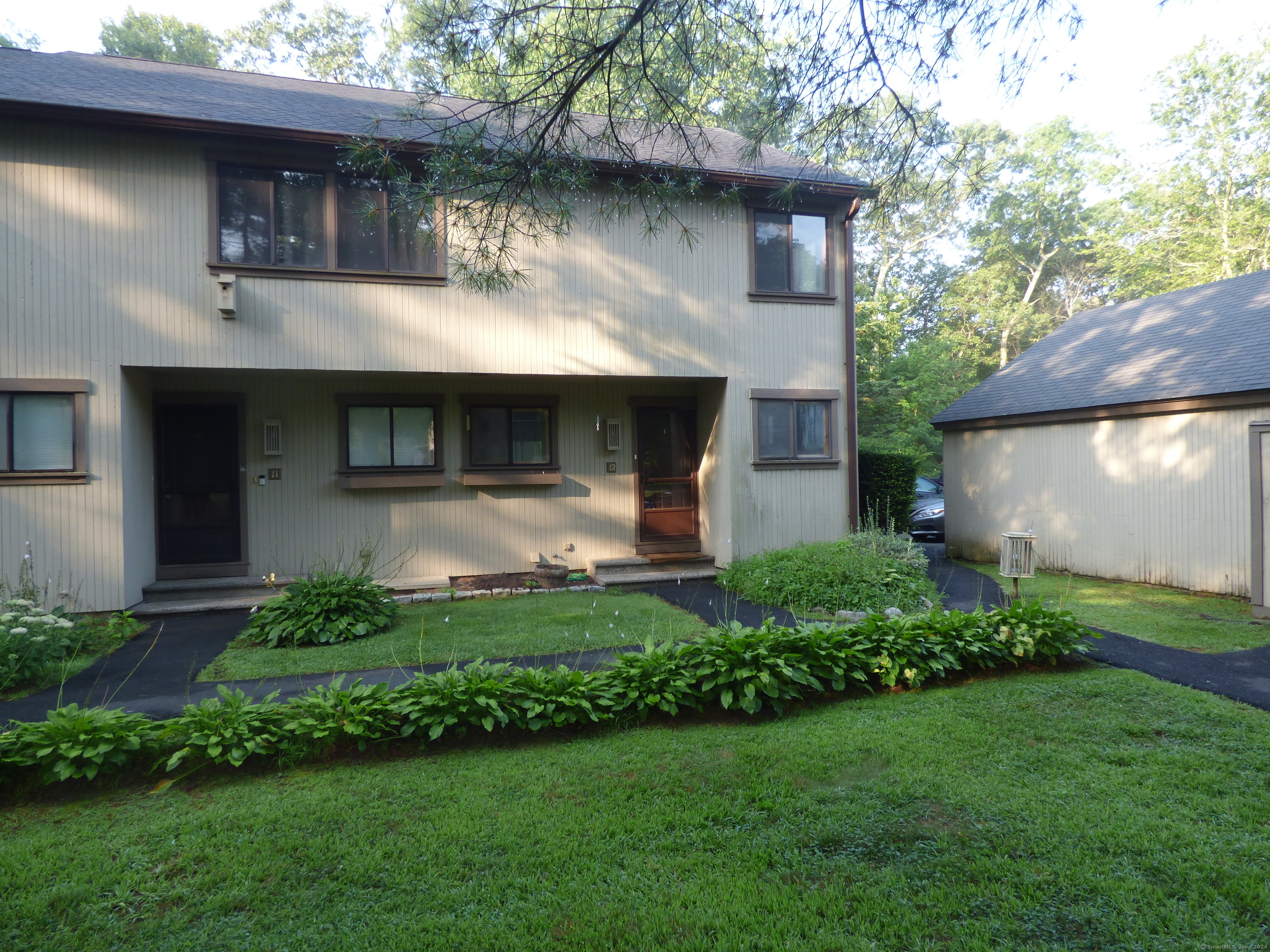 Welcome to Woodlake! This is a great 2 bedroom, 2 bath end unit with a short walk to the 1 car detached garage. Hardwood floors throughout the main level with sliders off the living room to the deck. Kitchen has a breakfast nook, plus a dining area. Carpet in both large upper level bedrooms and hallway. Master bedroom has full bath. Partially finished basement with laundry room and plenty of storage. Easy I-84 commute. Good credit, 2 months deposit and references a must. No smoking. No Pets. Ask for application and link to credit check