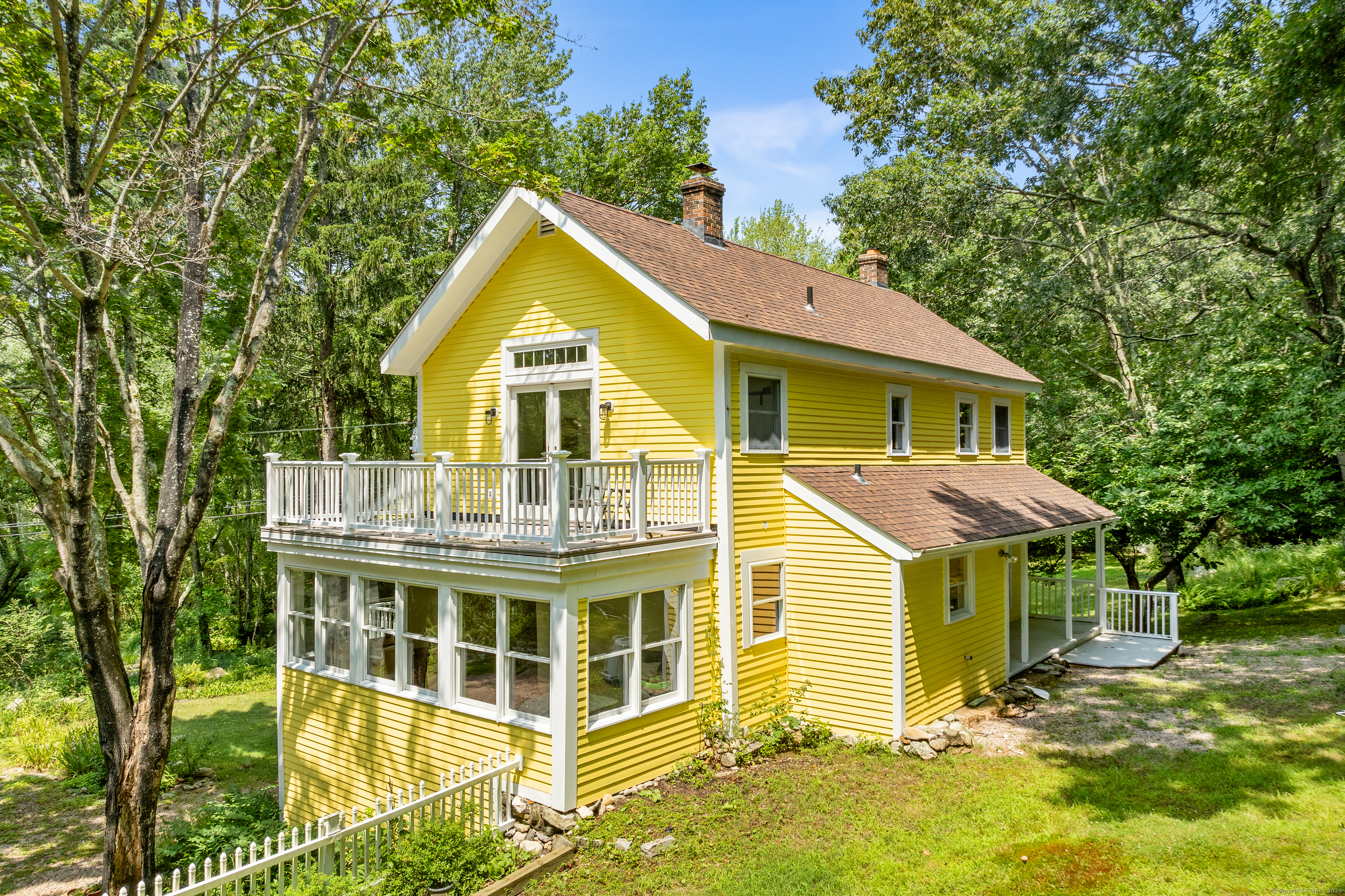 Completely renovated just last year, this enchanting home set on 1.23 acres in Mystic, CT, is your gateway to modern luxury and timeless charm. Imagine stepping out your front door to explore miles of scenic walking trails through neighboring Avery Farm Nature Preserve, or taking a short, leisurely drive to the delightful Olde Mystic Village, less than 5 miles away. Transformed with over $225K in upgrades by the esteemed Reagan Construction Group, this stunning residence is more than just a house-it's your idyllic vacation retreat. With three beautifully appointed bedrooms and two stylish, contemporary bathrooms, every space has been thoughtfully created to blend comfort with elegance. You're greeted by the rich glow of stunning hardwood floors that flow throughout the home, setting the stage for an ambiance that's both sophisticated and welcoming. The heart of this home is its kitchen, where lovely finishes invite you to create culinary masterpieces, whether for grand gatherings or intimate dinners. The living areas beckon with their cozy atmosphere, perfect for making memories. Every detail has been meticulously considered, from the updated electrical and cooling systems to the stylish finishes, ensuring this home is smart and beautiful.