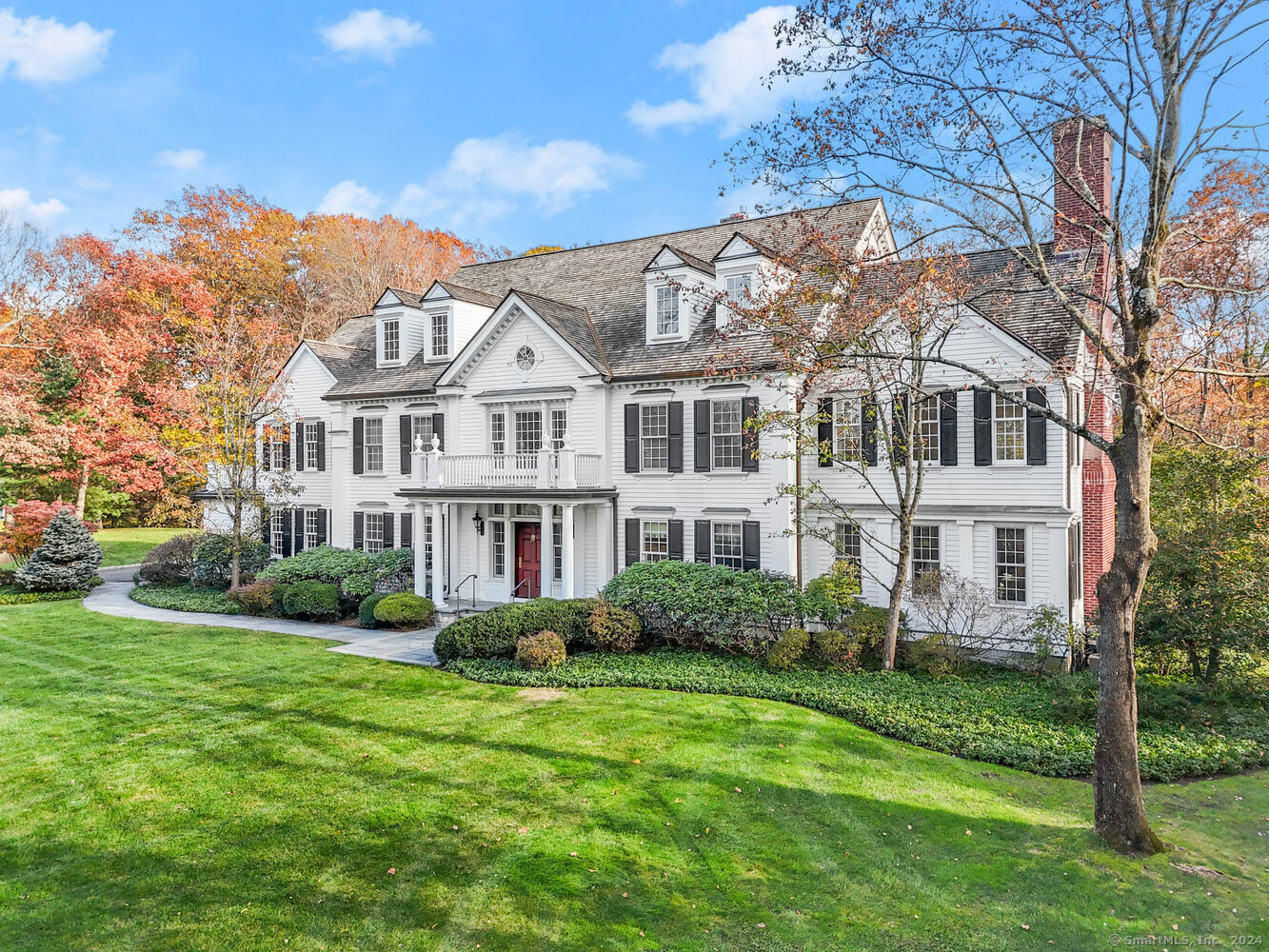 Nestled in the prestigious Sherwood Farm Association enclave, this stunning custom built Georgian Colonial home offers a seamless blend of timeless elegance and contemporary luxury across four meticulously designed floors.  The grand entrance foyer with its double height ceilings and a sweeping circular staircase sets the tone for the exquisite spaces within. Paneling and architectural details throughout reflect exceptional craftsmanship. French doors open to an oversized dining room with fireplace overlooking the back terrace. The living room features a stunning fireplace and cathedral ceiling. Adjacent is the cherry paneled library with fireplace and wet bar. The Christopher Peacock kitchen with white marble countertops and rotunda breakfast room combines functionality and style.  On the second floor, the luxurious primary suite includes fireplace, marble bathroom with jacuzzi and steam shower. Four double bedrooms each have their own en-suite marble bathrooms. The third floor offers a private au pair suite and bathroom, a playroom and an office with custom built ins.. The finished basement includes recreational area, a fireplace, wet bar, bedroom, a wine cellar and a gym.  Set on landscaped grounds, with a covered porch and a bluestone terrace the property backs up to woodlands. This Georgian Colonial is an ideal spot close to town in this sought after neighborhood.