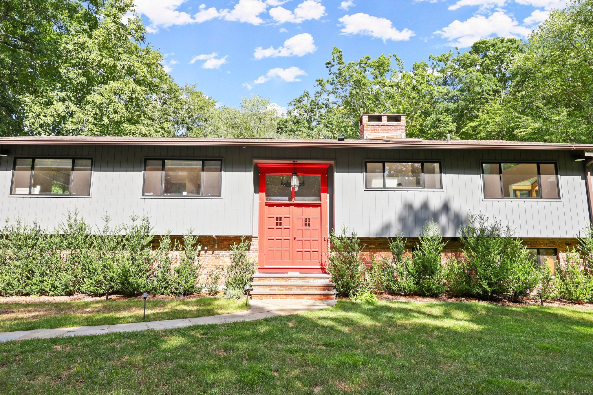 Welcome to this beautifully renovated home with upgrades galore including a sparkling new kitchen. The sun-filled residence offers 4 bedrooms plus a new office and 3 full baths, situated on a very private 2.16-acres just minutes from North Street Elementary. Ideal for entertaining, the property boasts a heated pool and spa, an expansive deck that spans the entire rear of the home, and meticulously maintained gardens. Enjoy the perfect blend of privacy and convenience in this exceptional property. The first floor showcases an open floor plan with vaulted ceilings and skylights, enhancing the spacious feel. The newly updated kitchen is perfect for culinary enthusiasts, while the living room, complete with a wood-burning fireplace, provides a cozy gathering space. This level also ncludes 3 bedrooms and 2 full baths, ensuring ample space for family and guests. The garden level is bathed in natural light and features a large family room with a fireplace, a fourth bedroom with a full bath ideal for guests or an au-pair a newly added office, a separate laundry room, and a mudroom. This versatile space offers privacy and functionality, catering to various lifestyle needs.