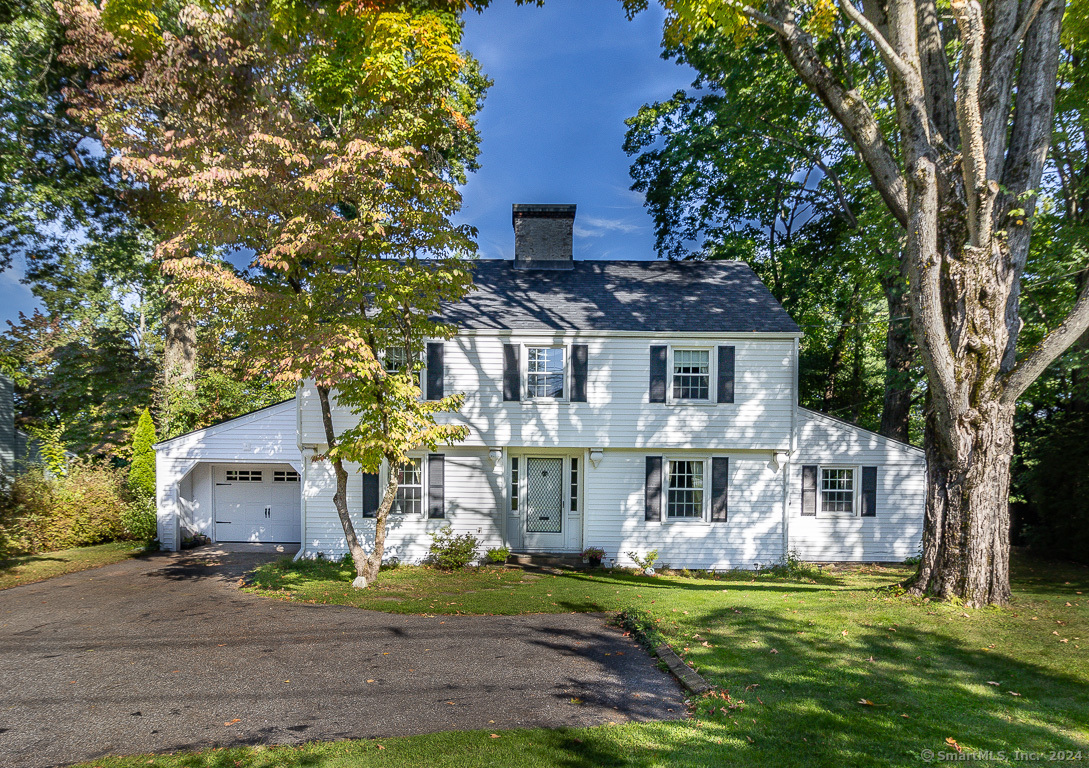 New price! Classic, stately and beloved! This steel beam, custom built Colonial with 4 bedrooms 2 1/2 baths with a FIRST FLOOR BEDROOM SUITE located in the heart of West Hartford is a beauty. The charm is in the details in this wonderful home. A classic foyer meets you at the front entrance. A front to back living room with picture windows and a fireplace is the heart of the home. The remodeled kitchen with granite counters, newer appliances, spacious island and access to the backyard gives great function and entertaining options. This home has a fabulous first floor bedroom suite with a full bath and a possible second entrance for easy one floor living. But it is the super cozy den in the back of the house you will love to settle into and relax with a cup of coffee. A great space for an office, playroom or family room. Up the staircase are the 3 bedrooms, nicely spread out for comfortable living. There is charm not to be missed in the archways and curves of the walls and the classic window nooks. While some minor painting and cosmetics could be needed, this home has SOLID BONES AND UPGRADES INCLUDING TWO YEAR ROOF, ALL NEW SIDING WITH GUTTERS AND LEAF GUARDS, NEW GARAGE DOOR, NEWER WINDOWS, NEWER OIL TANK AND A YOUNG SERVICED BOILER. Located on iconic Ridgewood Rd in the Duffy school district, minutes from West Hartford Center, Blue Back Square, West Farms Mall, I84 and the best fabulous shopping, dining and amenities in the area. This is a wonderful opportunity!