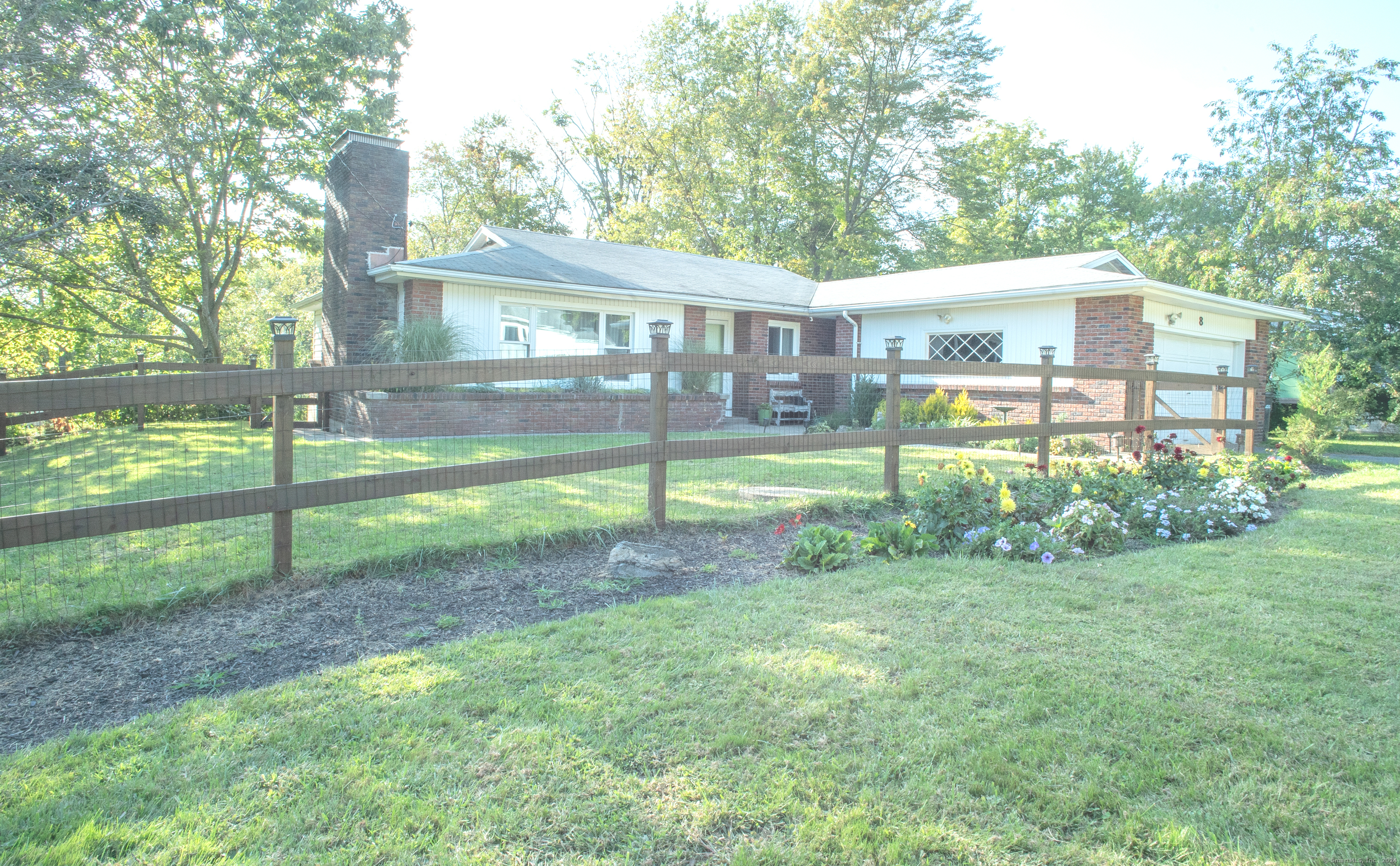 MUST SEE TO APPRECIATE THIS HOME! This unique Mid-Century Retro home is bright, charming, and spacious. New porcelain checkered tile honors the retro style of the eat-in kitchen with brand-new Quartz countertops, 36in: cooktop, dishwasher, and ceramic sinks. The kitchen includes a large walk-in pantry and an attached laundry room with a walk-out to the deck, perfect for entertaining and watching the sunset with family and friends. The dining/living room is an open space with banquette seating, a large fireplace with built-in shelving, and a picture window that invites natural light all day. With new upstairs windows, hardwood floors throughout, 3 large bedrooms, 2 full baths, ample closet space, a large walk out basement/storage, newly fenced in front yard, 2-car garage, new septic 2022, situated on 0.50 acres on the Danbury/New Fairfield border, this 1950's home is beyond delightful, with endless possibilities. Close to grocery, restaurants, Starbucks, hiking trails, Marjorie Lake with reservoir winter views, and 6 miles to I-84.