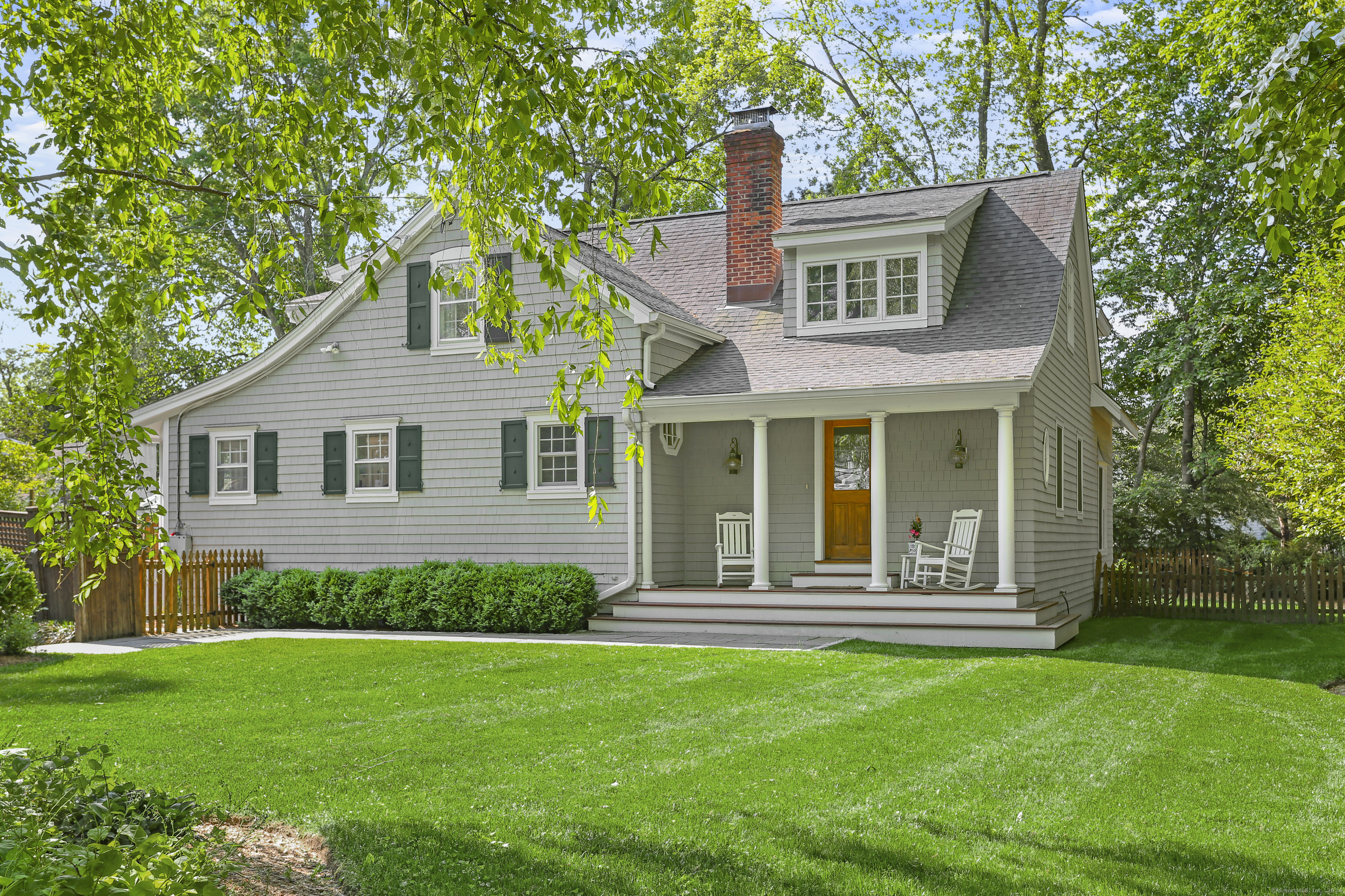 This remarkable Rowayton -Nantucket style colonial is waiting for you! This bright, charming and spacious home has so much - including a full kitchen renovation in 2023 with all new cabinets, countertops and appliances. There's even a sunny eat-in area with bay window seating and access to a lovely patio for grilling and entertaining. There's a formal dining area that leads to a generous sized living room with fireplace. Beyond the dining room is a home office/5th bedroom and full bath. Through the living room you'll be wowed by the sunny and spacious family room which leads to the back patio and fenced in yard. Upstairs the primary bedroom with vaulted ceiling includes a dressing area, walk in closets and full bath. Three additional bedrooms which share a large full bath complete the upper level. The perfect blend of sunshine and privacy creates an ideal backyard space for entertaining and relaxing. Ride your bike to Bayley Beach for Sunday Summer concerts, walk to downtown village shops and restaurants and train. 2 Memory Lane is the Rowayton home you've been waiting for.