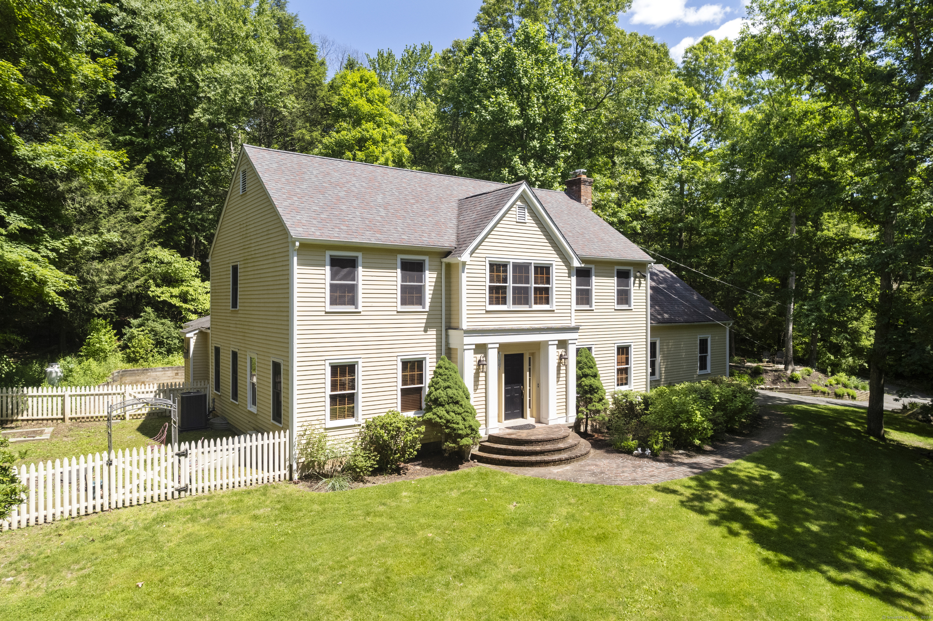 You've just discovered the best kept secret in Southbury-Old Poverty Road! This near-to-town home, nestled in the heart of Southbury sits on a designated Scenic Road alongside Platt Park that boasts numerous hiking trails leading in, around and through forest and farmland. Well loved by its original owners, this home has NEWLY refinished hardwood floors throughout the main level. The living room can be made warm and cozy with its wood burning stove within the brick fireplace. The kitchen has recently refinished cabinets, granite countertops, and an enclosed coffee nook. Surrounded on two full sides of windows, the GREAT room is the home's center of activity and relaxation with its floor-to-ceiling built-in cabinets, a gas fireplace and loads of sunlight. The main level also includes a dining room, half-bath and a large room suitable for a formal dining room, office or game room. Located up the central staircase is the primary bedroom and ensuite bath; three spacious bedrooms, a second full bathroom and walk-up attic. The basement is partially finished, newly epoxied floors, bright lighting with lots of closet and storage spaces. NEW furnace/air cond installed last year. Located in the rear of the house is a spacious deck, great for hosting happy gatherings of family or friends. Additionally, the town pool, playgrounds, baseball fields and tennis & pickleball courts are minutes away. This home provides style options, privacy, convenience, and tranquility. Move in ready!