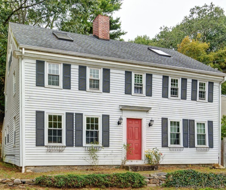 Nestled in the picturesque neighborhood of Niantic, this residence has historic details, including a stately facade, original wide plank and hardwood floors to enjoy the charm of a bygone era. As you enter, you're greeted into the living room, with new hardwood floors, a cozy fireplace and large windows that fills the space with natural light. The dining room is perfect for entertaining. The well-appointed kitchen combines period charm with contemporary amenities, offering ample cabinetry, butcherblock countertops, Frigidaire stove, double farmers' sink, skylights, French doors to coy pond & garden area. Upstairs, you'll find generously sized bedrooms with hardwood floors, along with 2 full bathrooms. The second bedroom which can be used as the primary has an additional sitting area. Second floor also has a slate floored heated solarium and kitchenette are-perfect for relaxing or entertaining. The back patio is ideal for quaint outdoor gatherings or for quiet evenings under the stars. The detached garage provides extra parking for your cars or for storage. Located within walking distance to parks, beaches, schools, and local shops, this home has the perfect blend of historic charm and modern convenience.