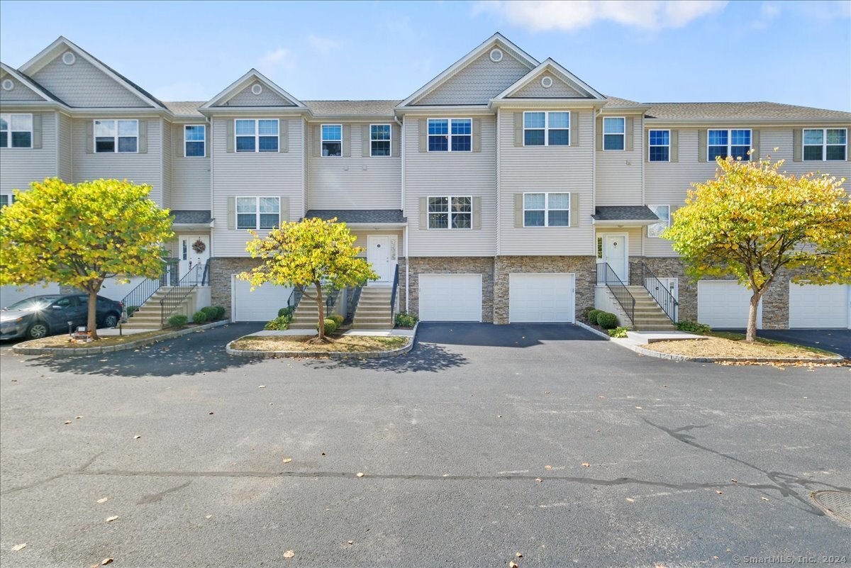 Nestled on the outskirts of Brookfield Center, this three-level Riverview townhouse invites you to experience a lifestyle of comfort and tranquility. Step into an expansive sun-drenched open floor plan of the combo kitchen/living/dining rooms. The well-appointed kitchen features granite countertops, island, and stainless steel appliances, including a natural gas cooktop & French door refrigerator. Only steps away from the Trex deck, overlooking the grassy courtyard, perfect for relaxing after a long day or grilling out with friends. Upstairs, discover two inviting bedroom ensuites, each with ample closet space and ceiling fan. The laundry area completes this level for added convenience. The finished lower level has endless possibilities, ideal for a cozy den, playroom, or home office, complete with walk-out access to a courtyard, access to one car garage, and extra storage. Freshly painted throughout. With easy access to lush trails, Candlewood Lake, and a vibrant community filled with dining and shopping options, this townhome truly embodies a perfect blend of convenience and nature.