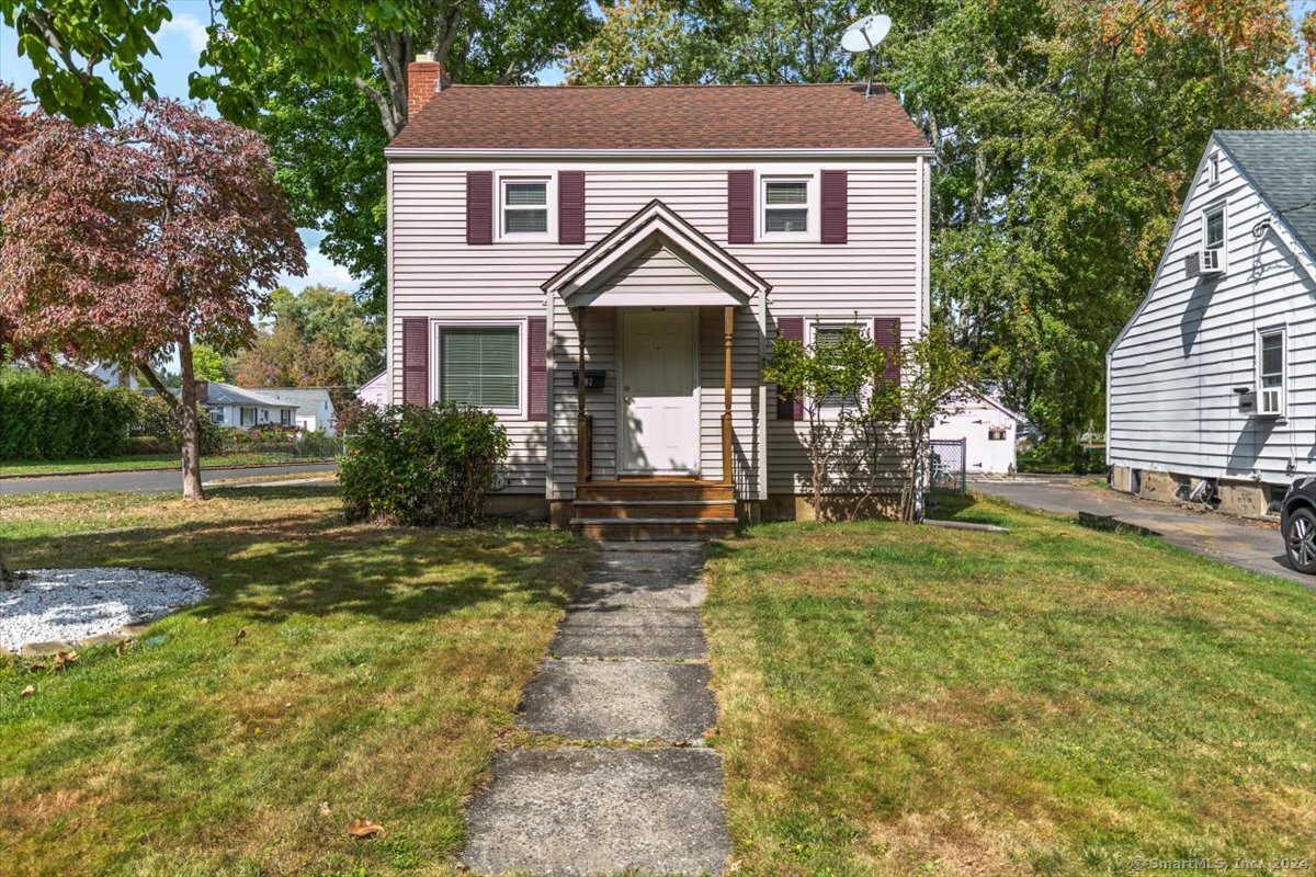 Welcome to this delightful 2-bedroom, 1-bath colonial nestled on a corner lot in the Elmwood section of West Hartford. Bursting with character and natural light, this lovely home is perfect for modern living while retaining its classic charm. Step inside to find stunning hardwood floors that lead you into the spacious living room featuring a wood burning fireplace-ideal for cozy evenings and entertaining guests. The first floor also boasts a formal dining room along with a functional kitchen that offers convenience and ease for everyday cooking. Upstairs, you'll discover two generously sized bedrooms, including an oversized primary bedroom with three closets, providing plenty of storage space. The vintage-inspired bathroom showcases original black and white tile, adding a touch of timeless elegance. The lower level offers additional finished space along with a new washer/dryer that are included in the sale! Situated on a corner lot, this property boasts a large, level, partially fenced yard-perfect for outdoor gatherings, gardening, or your four legged friends. With durable vinyl siding and replacement windows, this home is as practical as it is charming. Rest easy knowing that the big-ticket items have been taken care of: the roof was installed in 2012, and the gas heating system and central air conditioning were updated only 2 years ago! Don't miss your chance to own this enchanting colonial in a fantastic neighborhood!