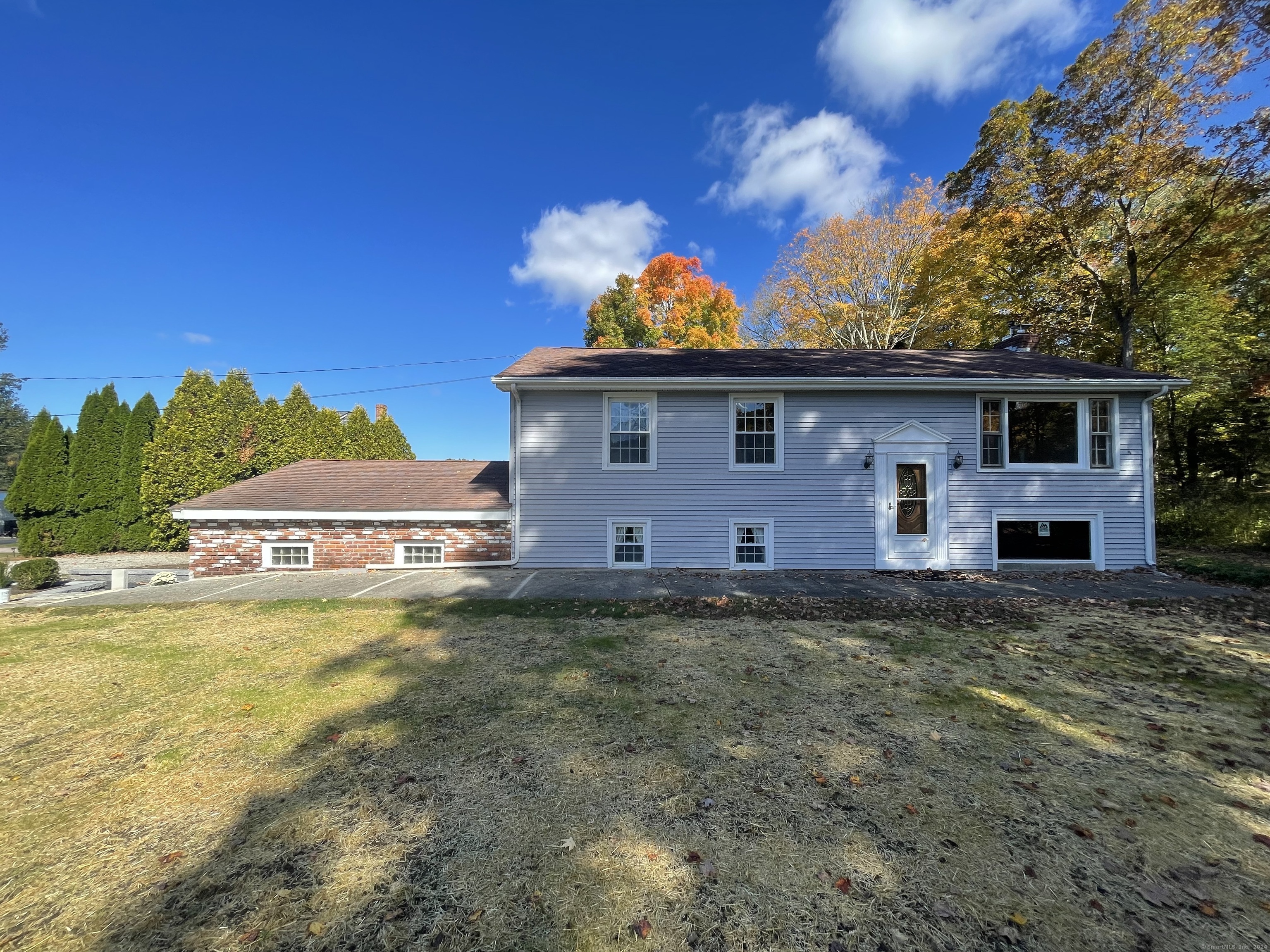 Original owner Waterfront Home with spectacular location on private side of Quaddick Lake! Easy water access along with an added bonus of a boat launch. Home features a newer well, vinyl siding, mostly replacement windows, & updated roof. 1500+ sq. ft. of living space on the first floor and additional 1, 200 sq. ft. of finished lower-level living space with tons of potential. Home features multiple fireplaces along with wood stove in the basement. This property has been well maintained and is ready for your ideas. There are 3 bedrooms and 1 bathroom on the main level with an additional bedroom and full bathroom in the lower level. Large eating space kitchen with water view along with hardwood floors throughout most of the main level. Home has been freshly painted. 1+ car garage along with workshop potential along with carport storage. Wrap around deck on front provide great water views. Brand New 4 Bedroom Septic just installed. Direct beach/waterfrontage but also shared ROW allows for convenient boat launch. New parking pad along with carport access under deck for additional storage.