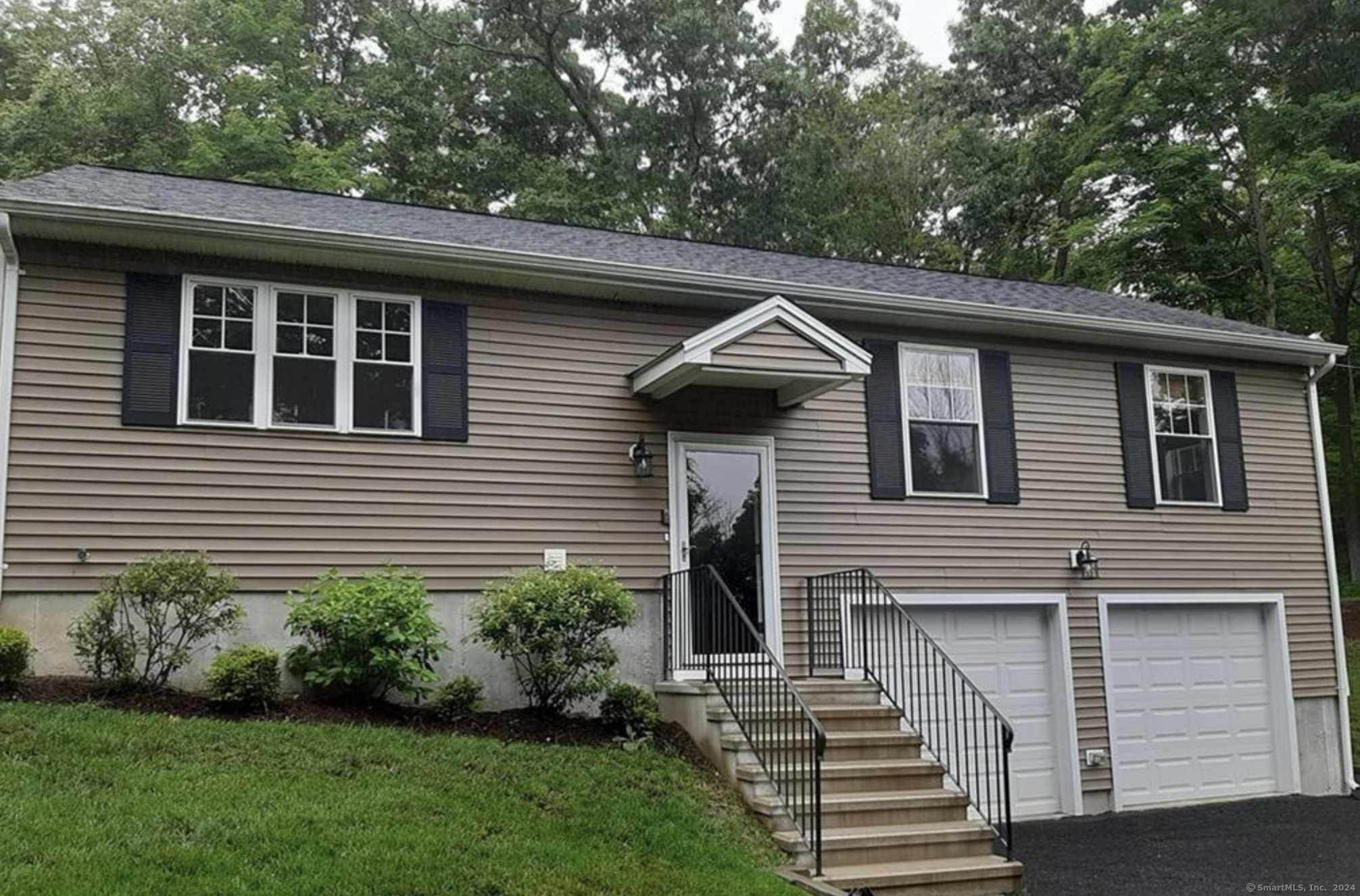 Experience the beauty of sunrises and sunsets from this charming country home. Priced to sell, this move-in ready Ranch was built in 2017 and features 3 bedrooms and 2 full baths. Its open layout seamlessly connects the Living Room, Dining Area, and Kitchen, perfect for modern living. Nestled at the top end of a private trail in the serene Berkshire Estates Section of Southbury, just over the Newtown line, it provides a tranquil escape from the hustle and bustle. Despite its peaceful setting, I-84 is conveniently located less than 5 miles away, making it easy to access the heart of Southbury. Embrace nature in this idyllic location near the Housatonic River, between Lake Zoar and Lake Lilinonah. The home boasts stunning knotty red oak floors throughout the Living Room, Dining Area, Kitchen, and Hallway, complemented by a cozy propane fireplace that creates a warm atmosphere. The kitchen is equipped with granite countertops and stainless steel appliances, enhancing your culinary and entertaining experiences. The main level includes a primary bedroom with an ensuite full bath, along with two additional bedrooms and a second full bath. Access to the oversized 2-car garage leads to a spacious unfinished lower level that offers storage options or potential for mixed use. The paved driveway provides ample parking. This country home is a perfect blend of comfort, convenience, and natural beauty!