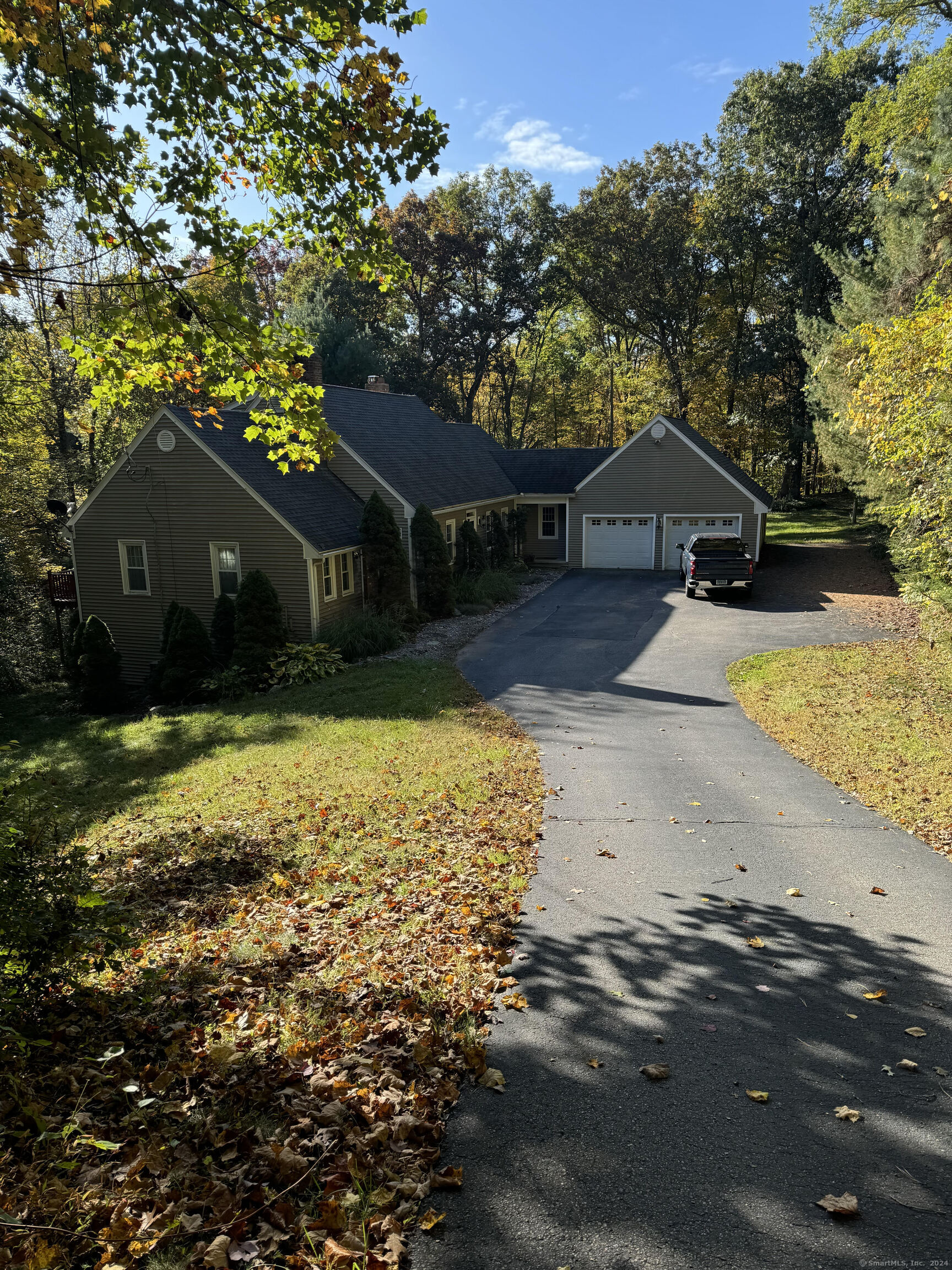 Welcome to this serene 18.3-acre estate in the tranquil community of Marlborough, just minutes from Route 2 and downtown Marlborough. With its prime location, you'll find yourself less than 20 minutes from Glastonbury center and within a short drive to the entertainment at Mohegan Sun. This expanded Cape-style home features four spacious bedrooms, providing ample space for family and guests. The master bedroom boasts a striking vaulted ceiling, enhancing its spacious feel and adding a touch of elegance. The heart of the home is complemented by a freshly painted interior, offering a modern aesthetic while allowing for personal touches to make it your own. A wraparound deck invites you to enjoy the beautiful natural surroundings, perfect for outdoor entertaining or peaceful mornings with coffee. The fully finished walk-out basement adds approximately 1, 000 square feet of additional living space, ideal for a family room, home office, or guest suite. With a two-car garage featuring convenient overhead storage, you'll have plenty of room for vehicles and outdoor gear. Nature lovers will appreciate the property's diverse wildlife providing a serene backdrop for outdoor enthusiasts. Explore the beauty of the local flora and fauna, making this property a true haven for those who cherish the great outdoors. Embrace the quiet, peaceful lifestyle this property offers while enjoying the convenience of nearby amenities and recreational opportunities.