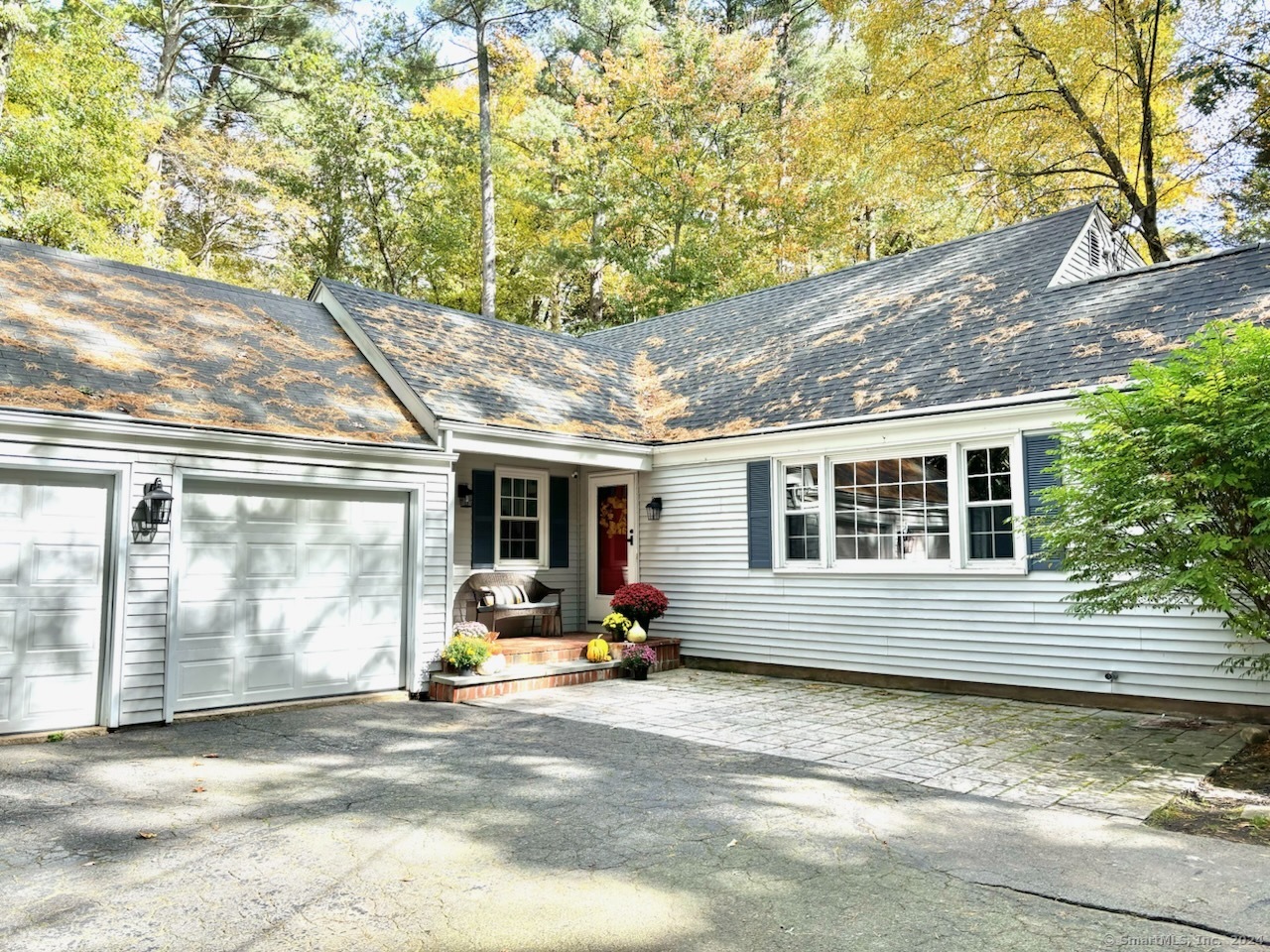 Discover the charm of this beautifully updated Cape Cod home in Simsbury, one of Connecticut's top-rated places to live. This inviting, move-in ready residence boasts a seamless flow while retaining a traditional dining room with a built-in China hutch and an eat-in kitchen. The spacious rooms have been freshly painted in a lovely modern palette, and the light fixtures have been modernized to suit today's lifestyle. The large living room, featuring a gas fireplace surrounded by built-ins, gives a warm welcome. The formal dining room leads to an updated kitchen with granite countertops, a stunning tile backsplash, new flooring, and newer appliances. Both full bathrooms, one on each floor, have been renovated. The full, walk-out basement is partially finished, with a large storage closet and an additional room perfect for an office space. The home sits on over an acre of flat, usable land, making outdoor entertaining easy with a front flagstone patio and a rear brick patio. Storage is plentiful with a 2-car garage complete with new garage doors. Additional storage rounded out with two sheds. Close to shopping and amenities yet has a private feel. Significant updates ensure this home is picture-perfect and low maintenance for years to come, including a new boiler system installed in 2020 and a new roof added in 2015.