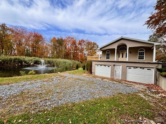 Experience the perfect blend of rural tranquility and equestrian potential with this approximately 2, 600 sq ft ranch-style home, featuring a 2-car garage and an additional 900 sq ft partially finished walkout basement leading to a scenic pond with a flowing fountain. A two-story front addition, complete with a garage, was added in 2008 to the original 1998 3-bedroom modular structure at the back. The home's entire interior was renovated in 2019, along with updates including new siding, gutters, and oversized decks with ramps to both the front and back entrances. The rear roof was recently replaced. Enjoy dual-zone heating and A/C, cathedral ceilings, paddle fans, two extra tiled rooms perfect for office or guest use, and abundant closet and storage space throughout this peaceful retreat. The property is heated and powered by propane (1000-gallon owner-owned above-ground tank) for hot water, and cooking. The back deck opens to a fenced-in, approximately 2, 000 sq ft landscaped play area. Completing the expansive 6-acre property is a fully mowed field and a partially finished 2, 800 sq ft barn equipped with a workshop, 5-6 stalls, and underground utilities. Whether you envision an equestrian sanctuary, a hobby farm, or a serene countryside escape, this property offers limitless possibilities.