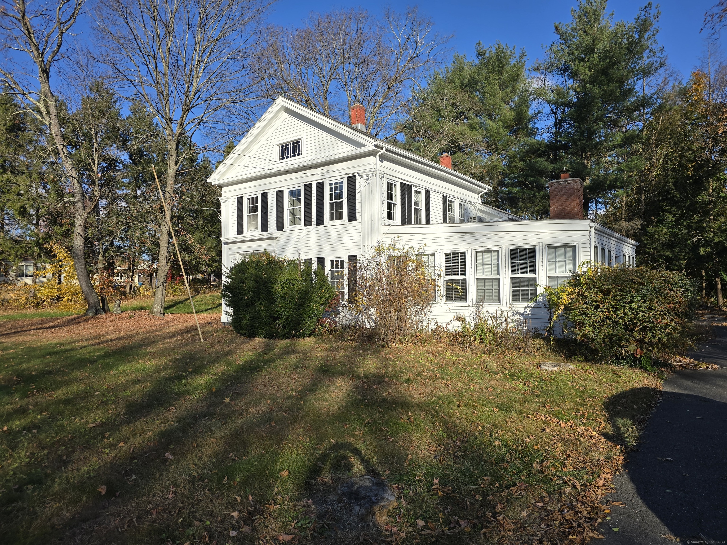 Discover the charm of this historic colonial ready for your personal touches! This spacious home boasts 4 bedrooms and 2 bathrooms within 2, 418 square feet of living space, situated half an acre of beautiful land. Enjoy the large great room filled with natural light, complete with a cozy fireplace, and take advantage of the two staircases leading to the second floor. The property features a brand new septic system (2022), a two-car garage, and a spacious driveway accommodating 5-7 vehicles, making it ideal for large families. While enjoying a country feel, you're just minutes away from grocery stores, retail shops, and a variety of amenities. Nature lovers will appreciate the nearby forest and the tranquil stream that runs by the side of the yard. Bring this magnificent home back to life and make it your own!