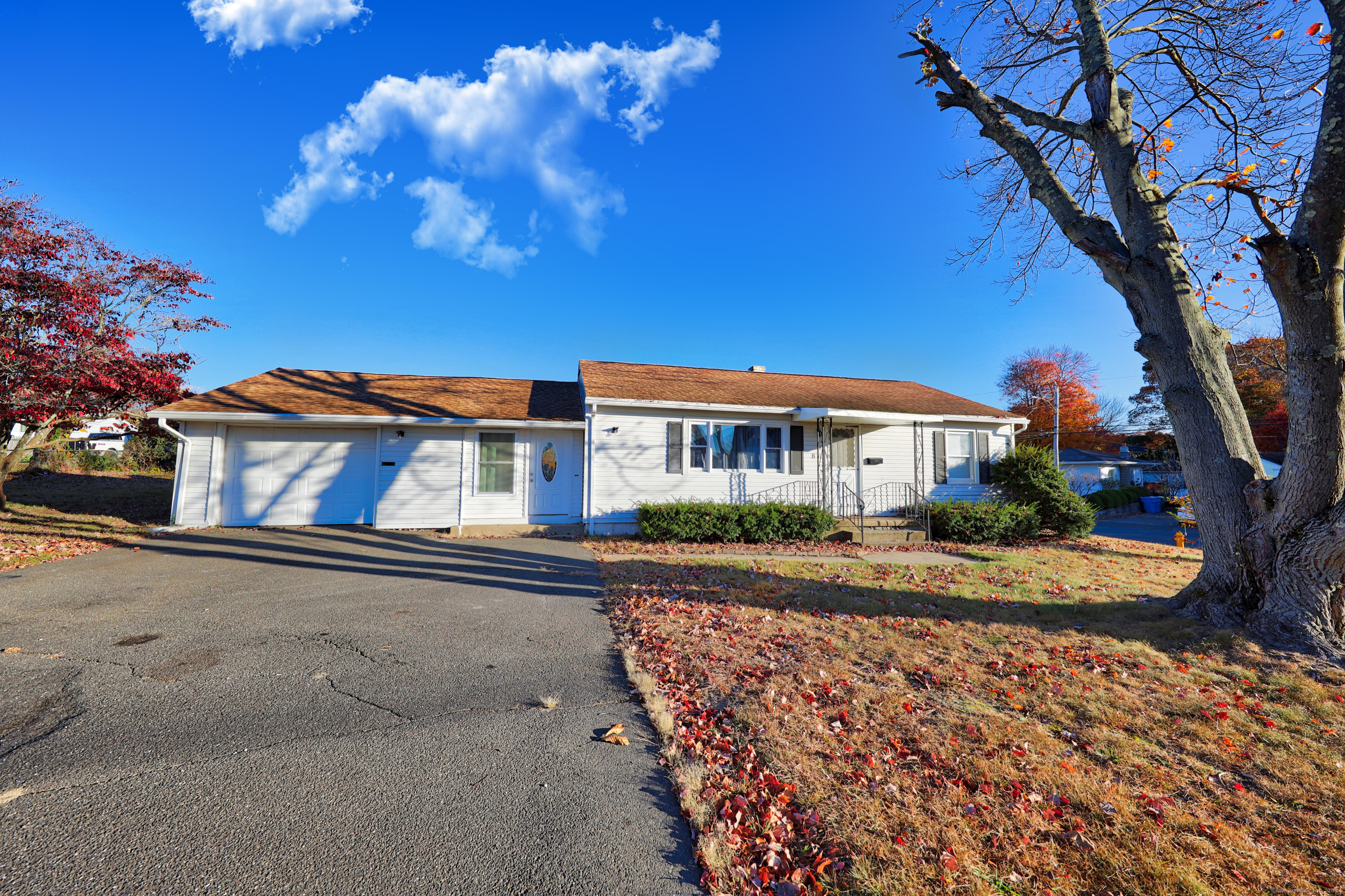 Welcome to this charming ranch-style home perfectly positioned on a corner lot in Waterbury's desirable east end. Step inside to a bright, airy living room where beautiful hardwood floors extend into the 2 bedrooms, creating a warm and cohesive ambiance. The living room flows effortlessly into the dining area, offering an open, connected space for gatherings with family and friends. The kitchen has tile flooring and a brand-new stove and refrigerator. Enjoy the comfort of newer central air and heat throughout the home, and take advantage of the finished basement, which provides valuable additional space, ideal as a recreation room, home office, or another bedroom. The property also features a welcoming breezeway connecting the house to the attached garage, offering convenient access to the back/side yard. Don't miss the opportunity to make this your new home!